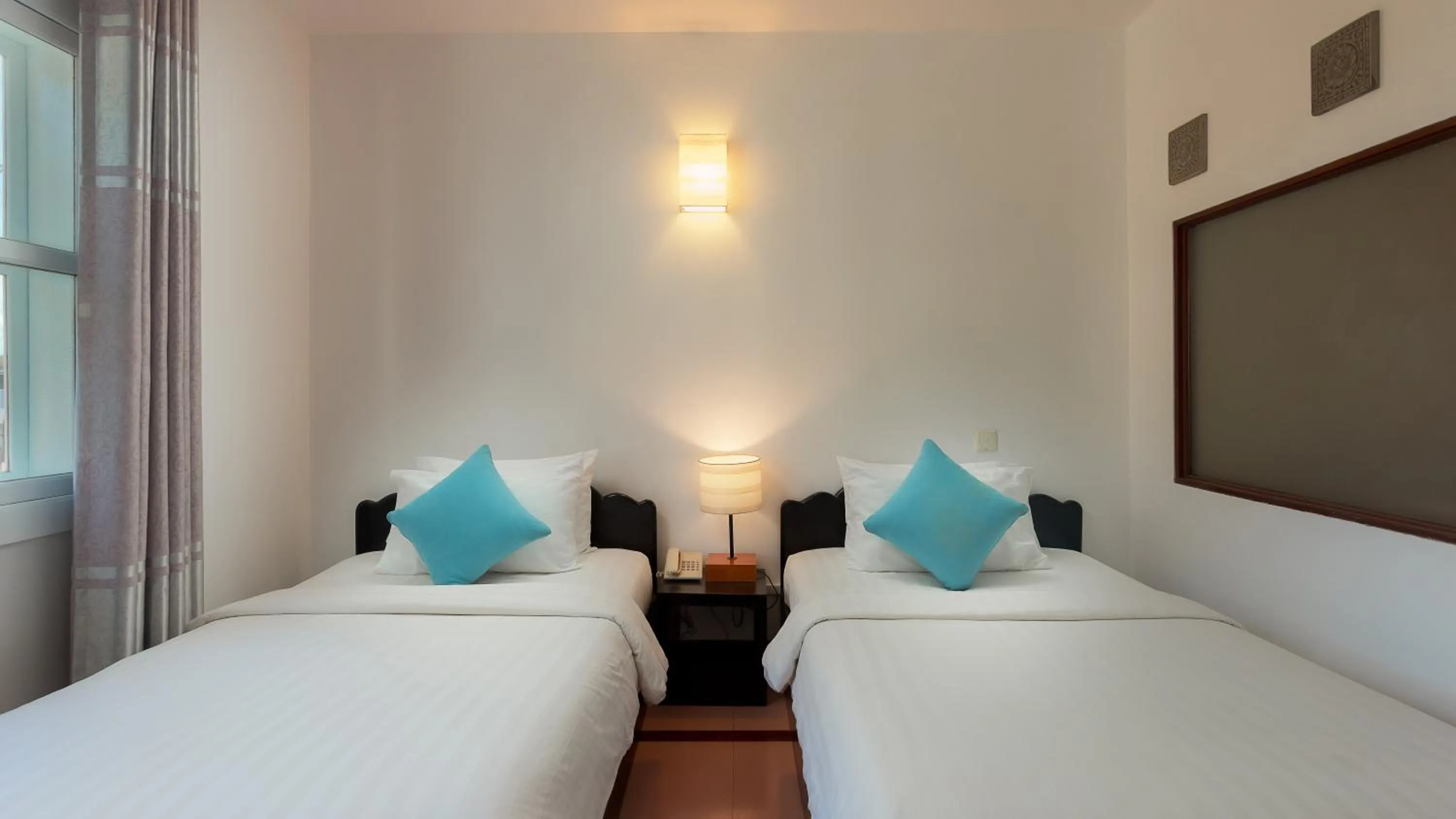 Bed in Amber Angkor Villa Hotel & Spa