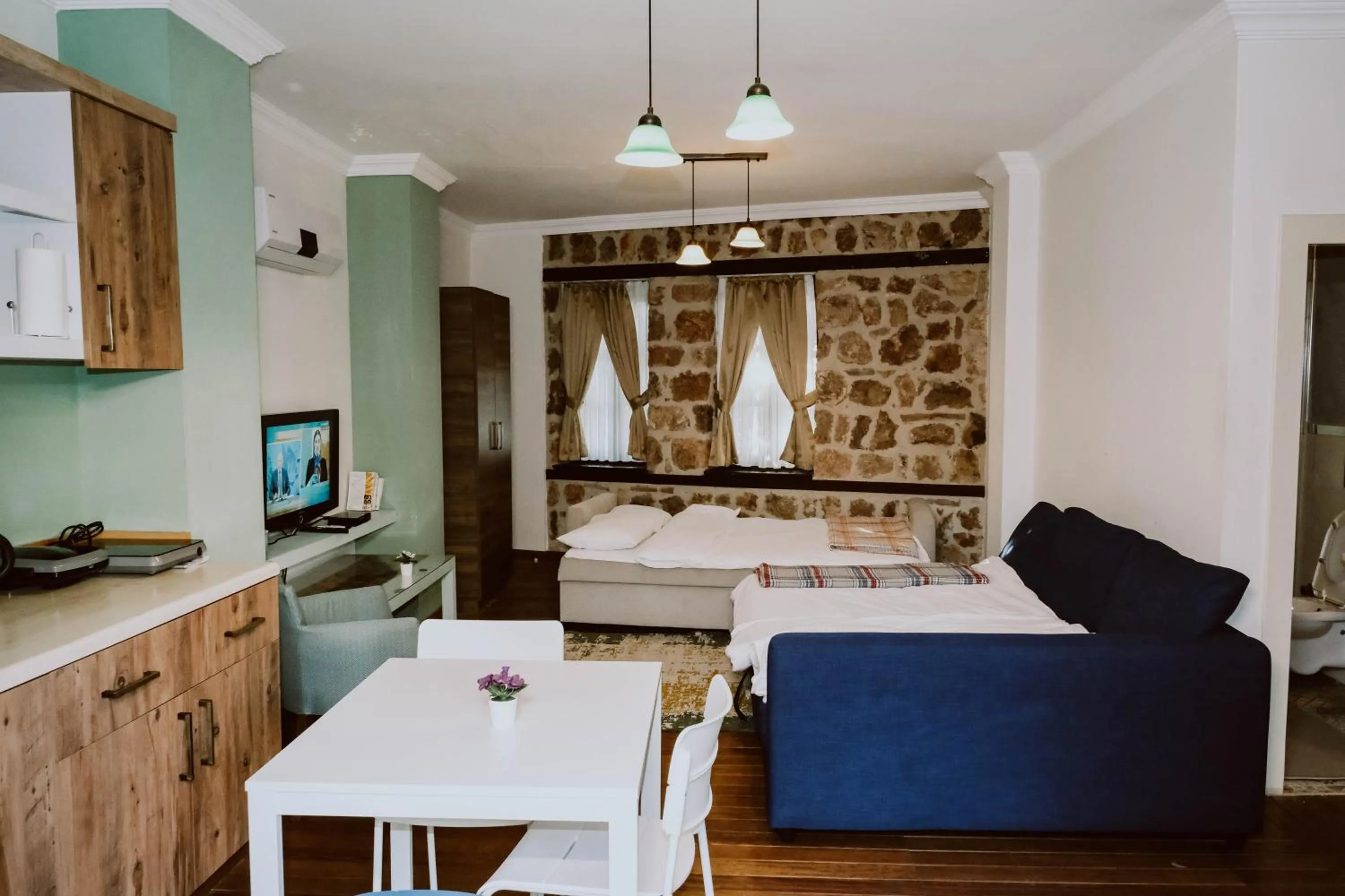 Living room, Bed in The Suite Apart Hotel