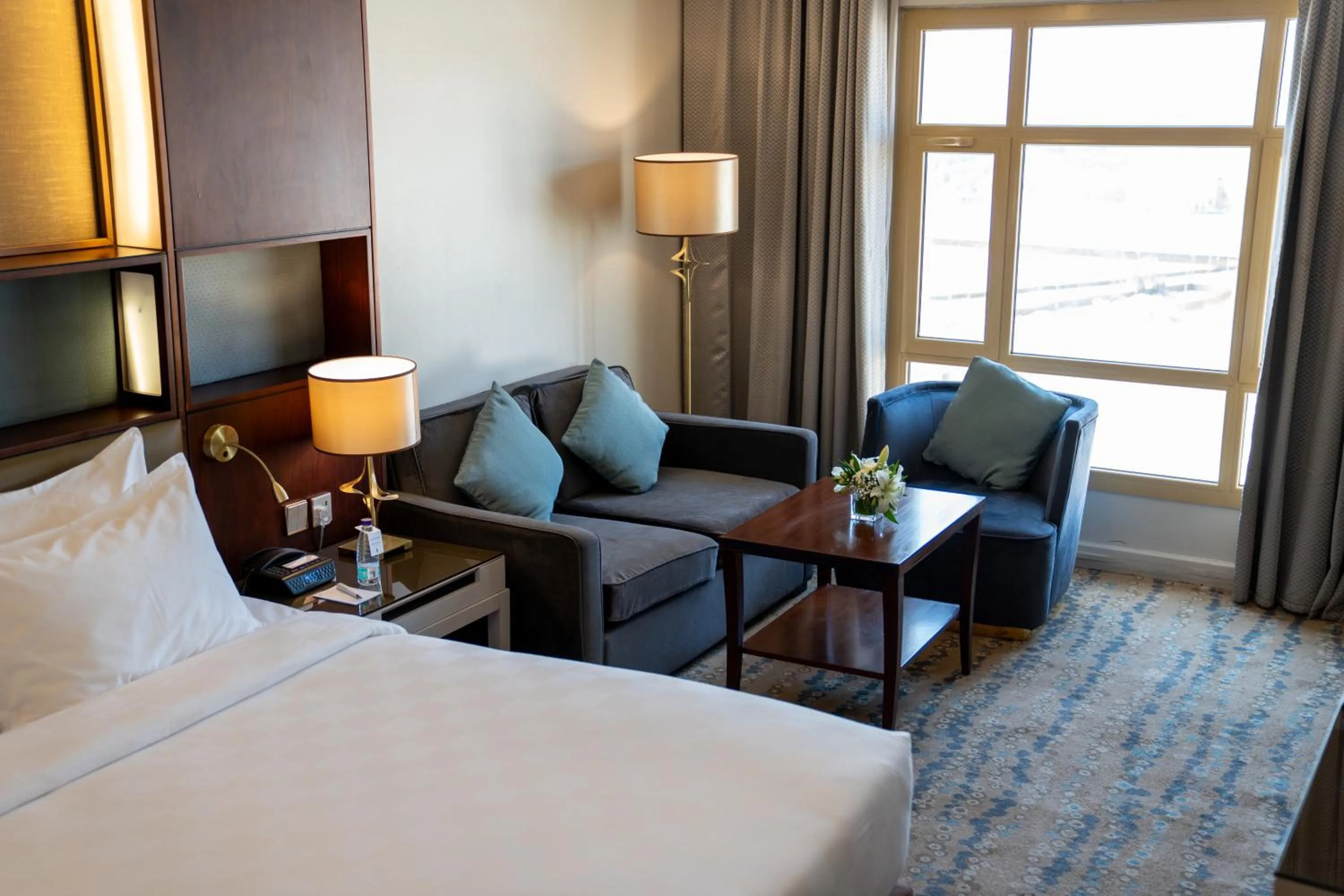 Seating area, Bed in SAJA By Warwick Madinah Hotel