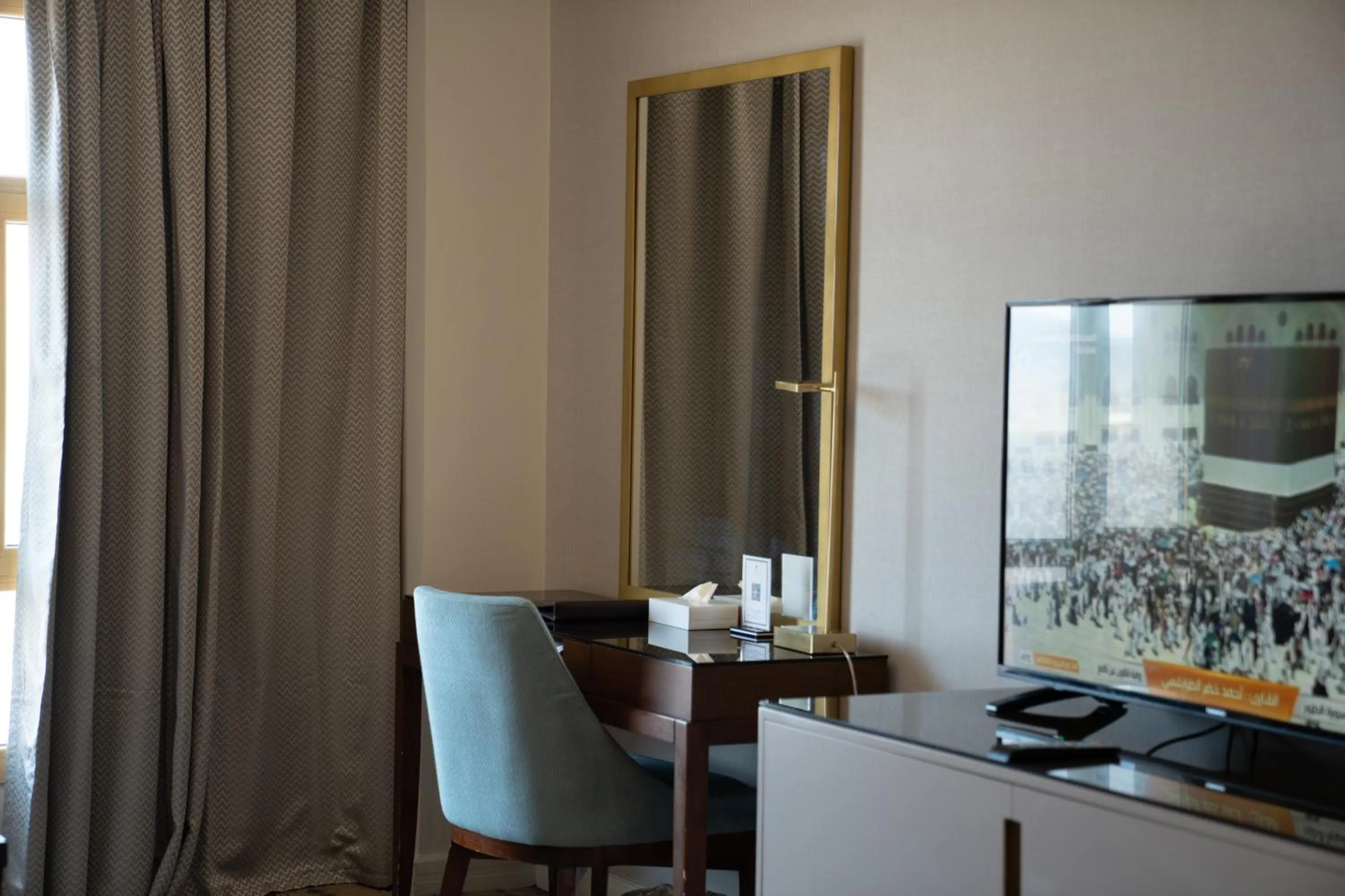 Communal lounge/ TV room in SAJA By Warwick Madinah Hotel