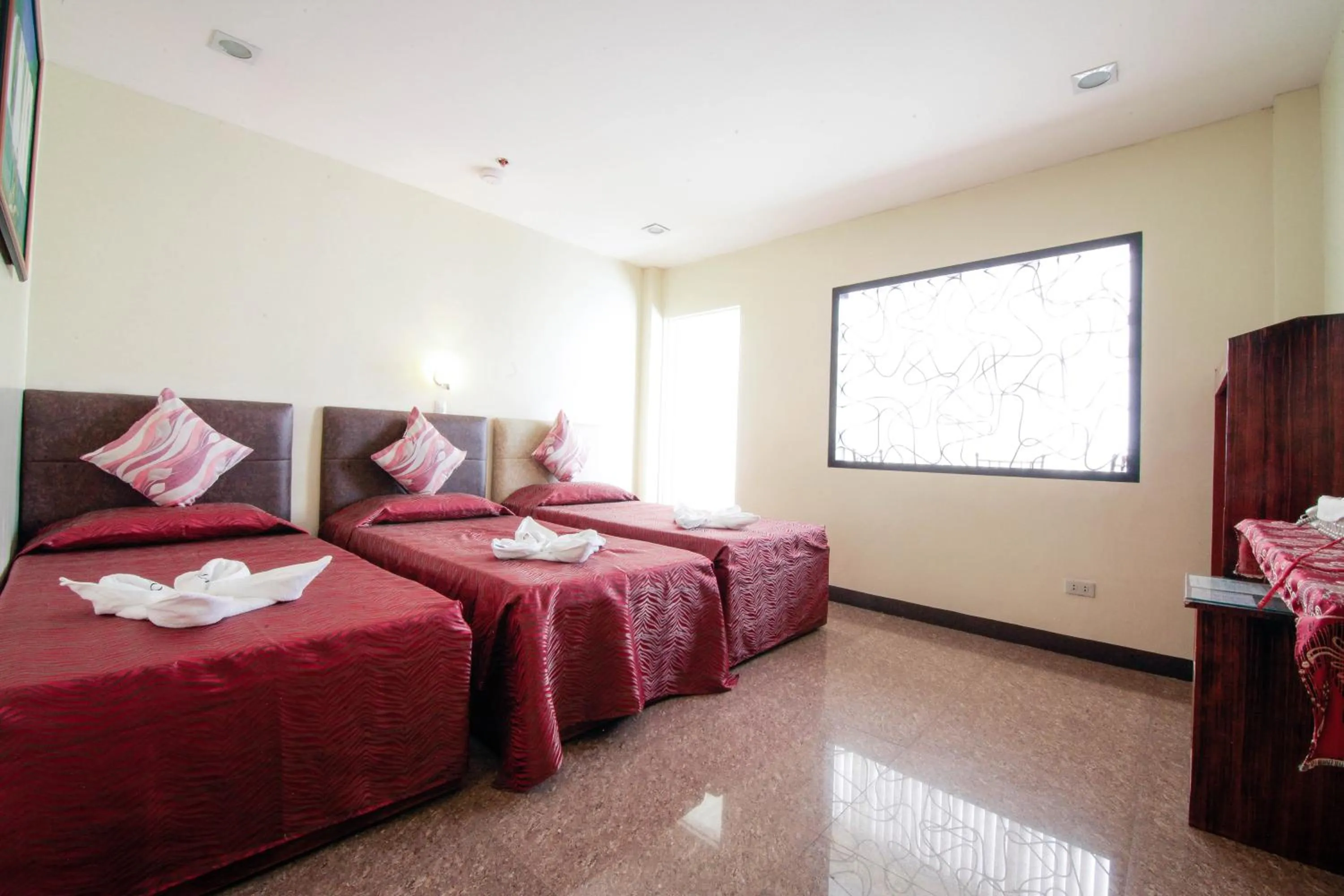 Bed in Fj Manila Hotel