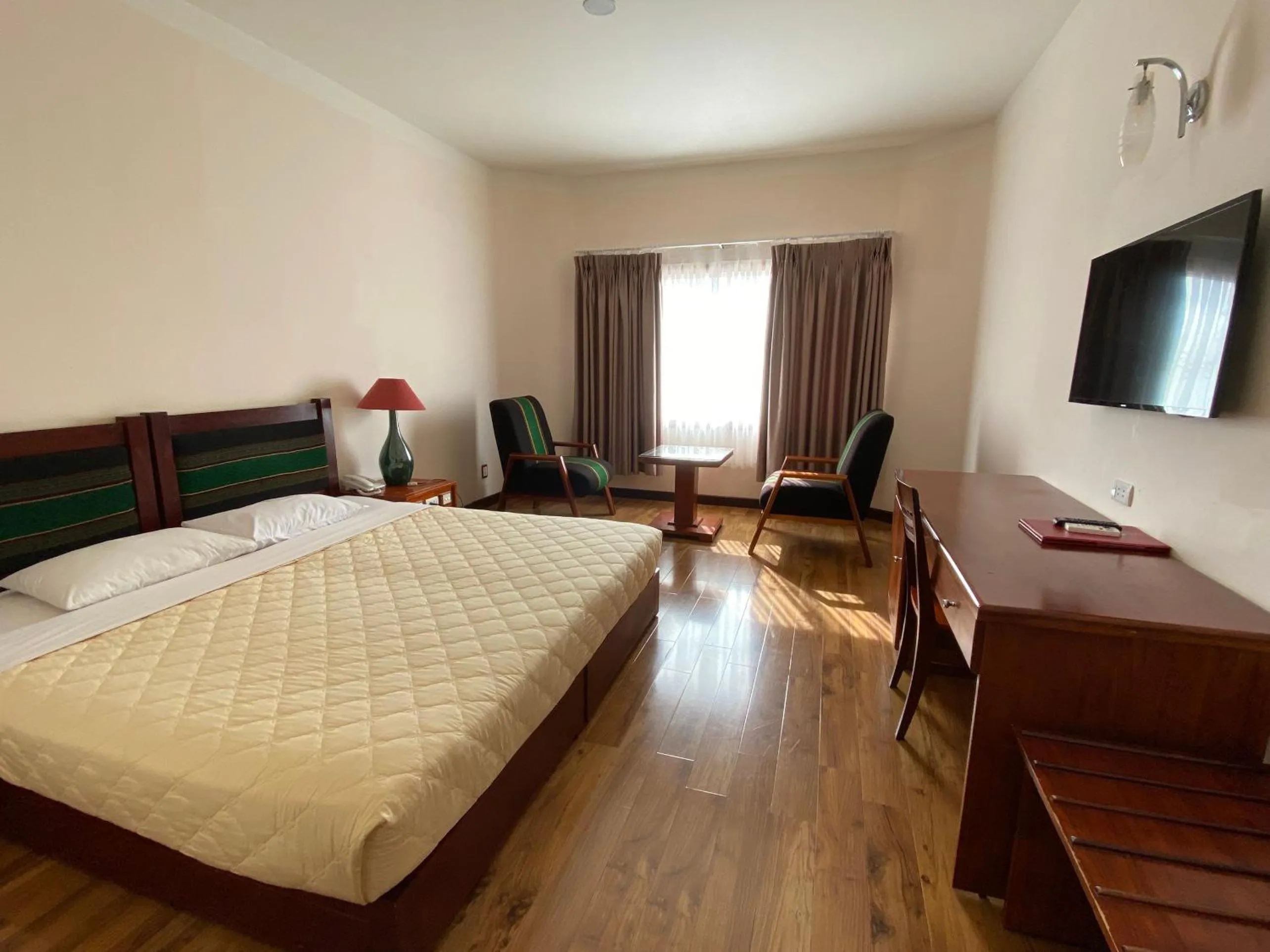 Bed in Dam San Hotel