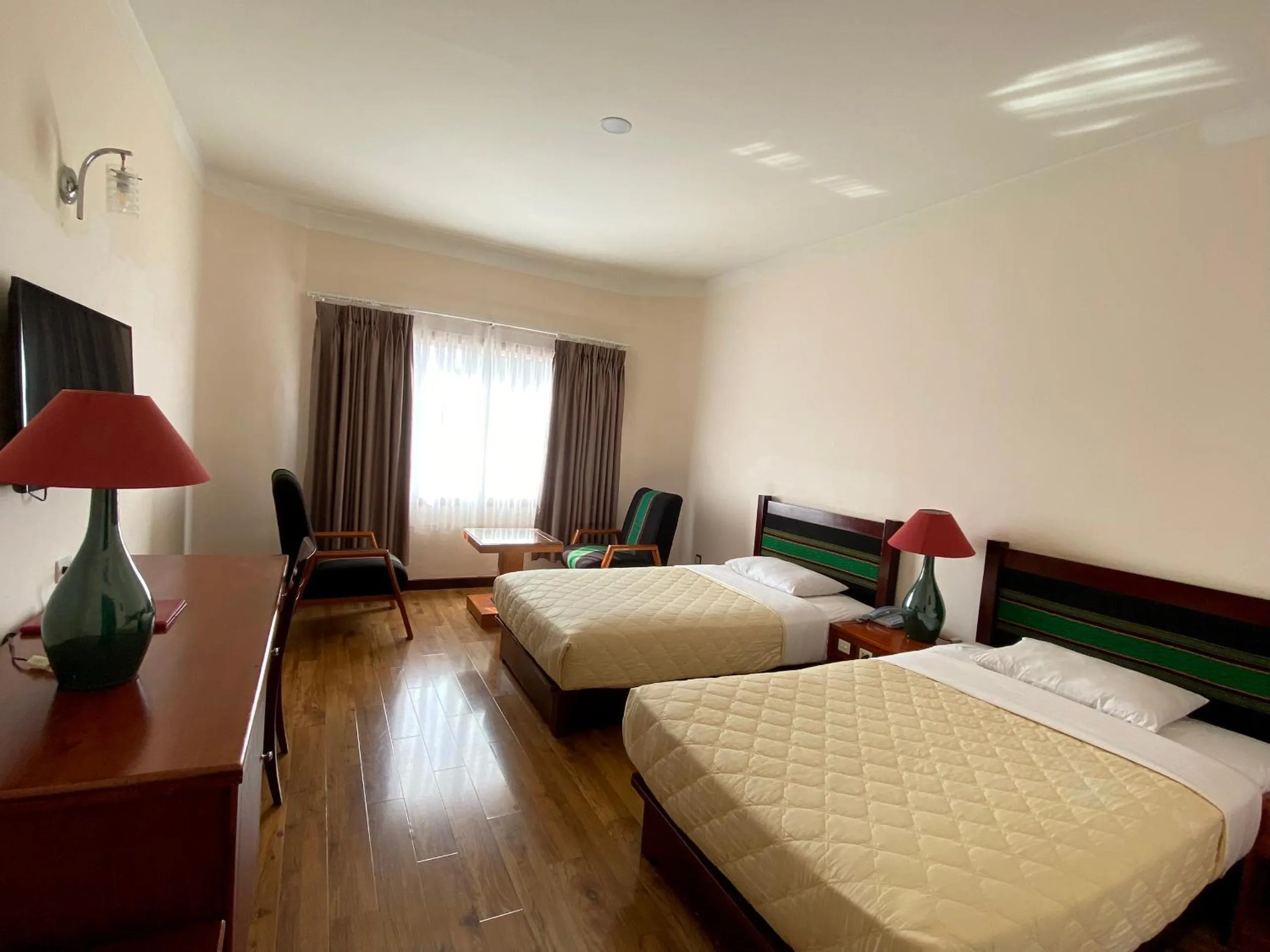 Bed in Dam San Hotel