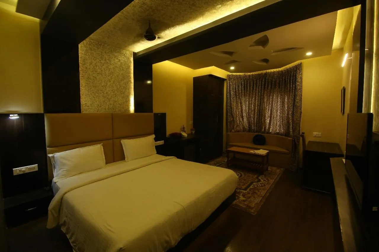Seating area, Bed in Hotel Sriram JB Residency