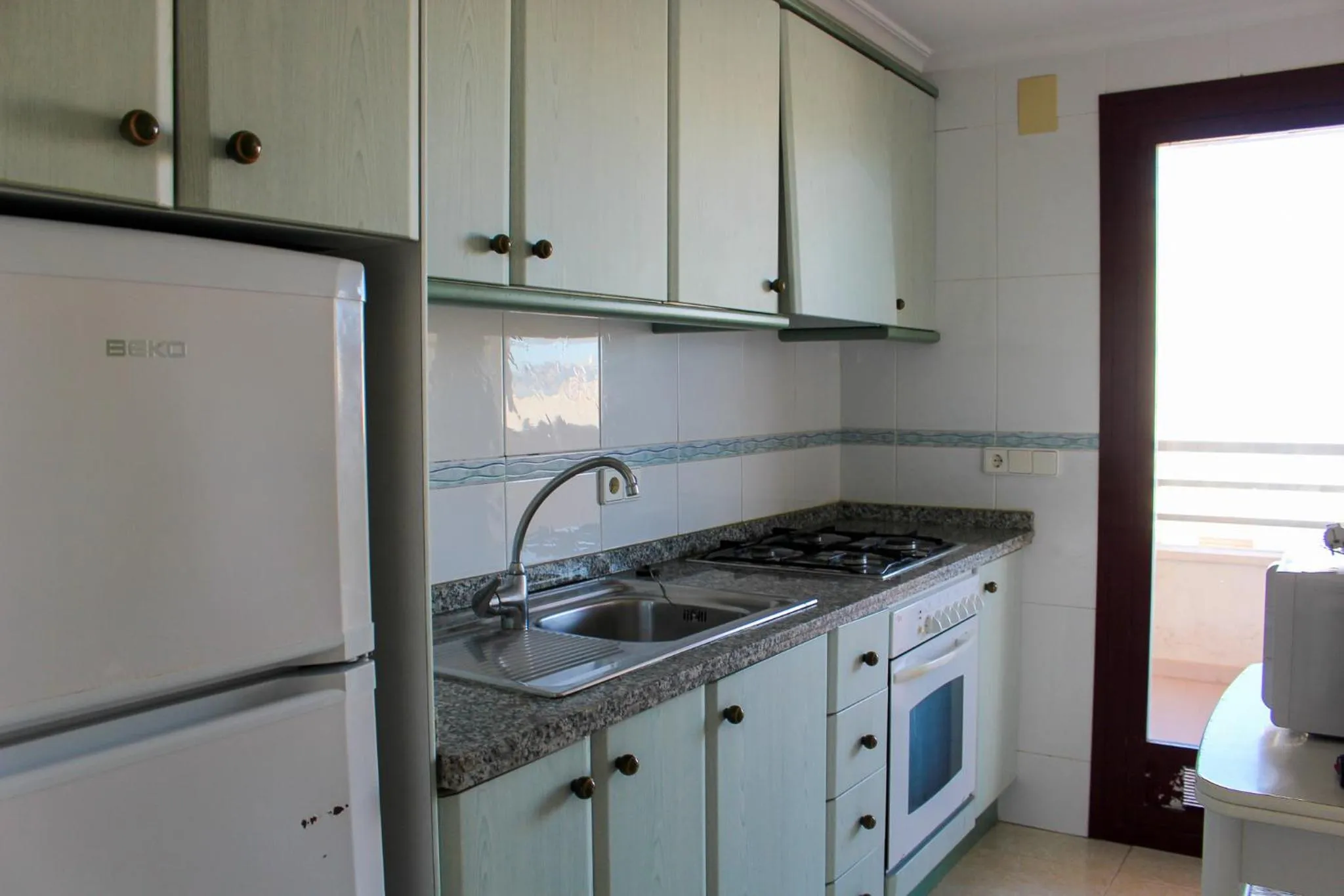 Kitchen or kitchenette in Apartamentos Zafiro Unitursa