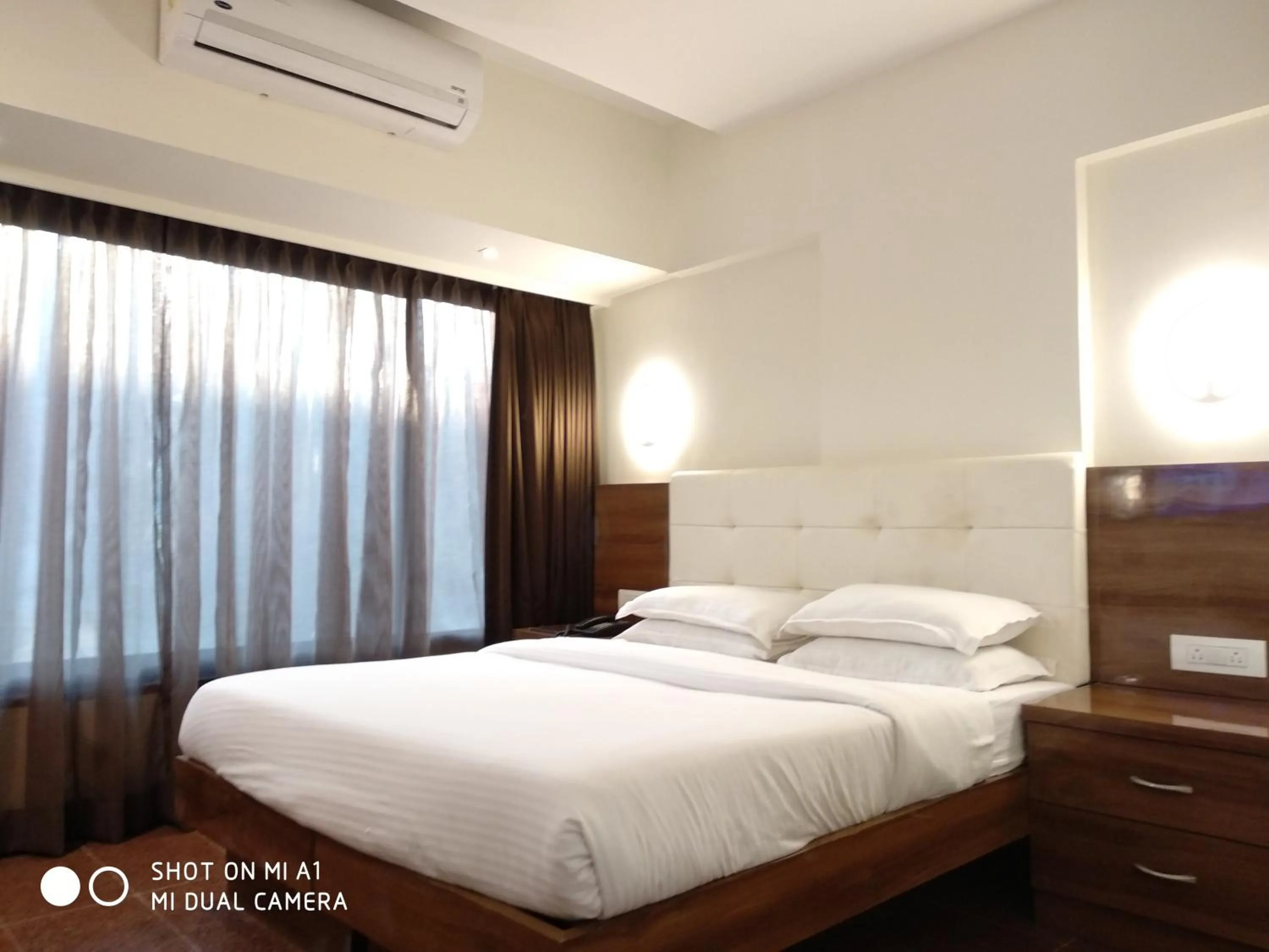 Bed in Hotel Milan International