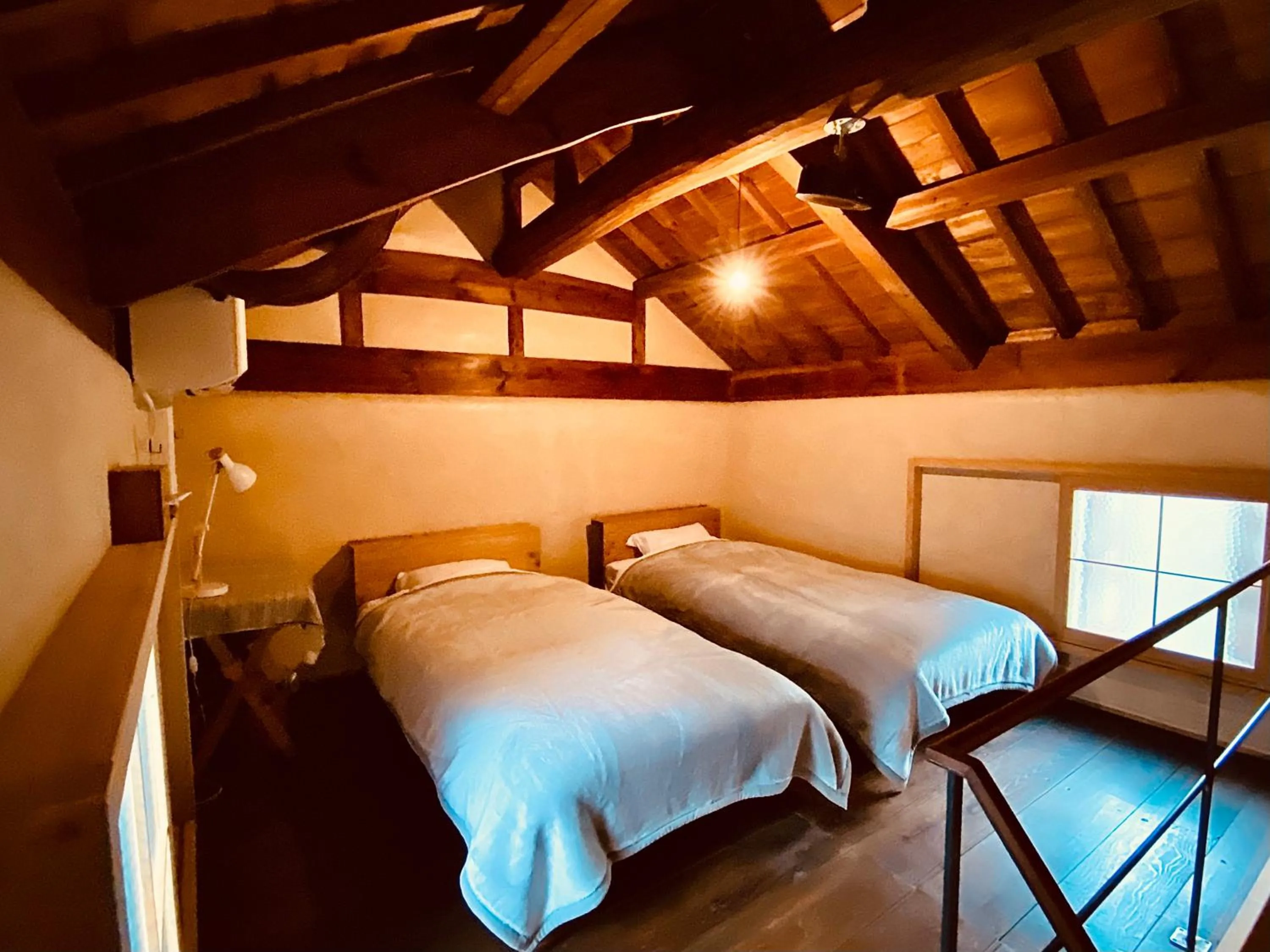 Bed in Yamada Bessou くつろぎの温泉宿 山田別荘