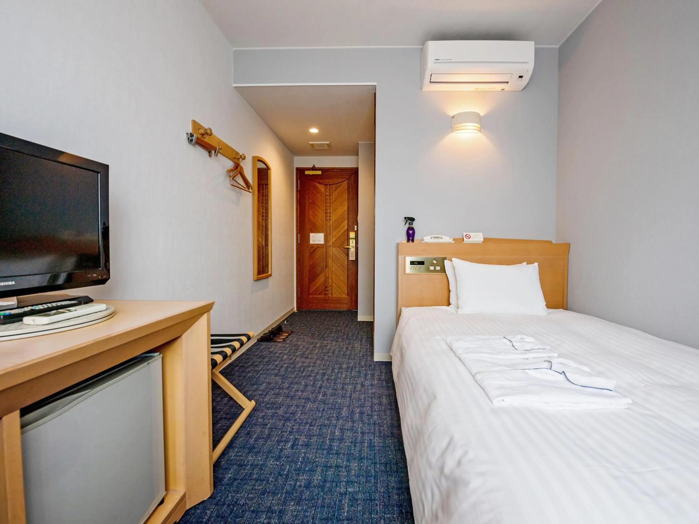 Bed in Hotel Azat Naha