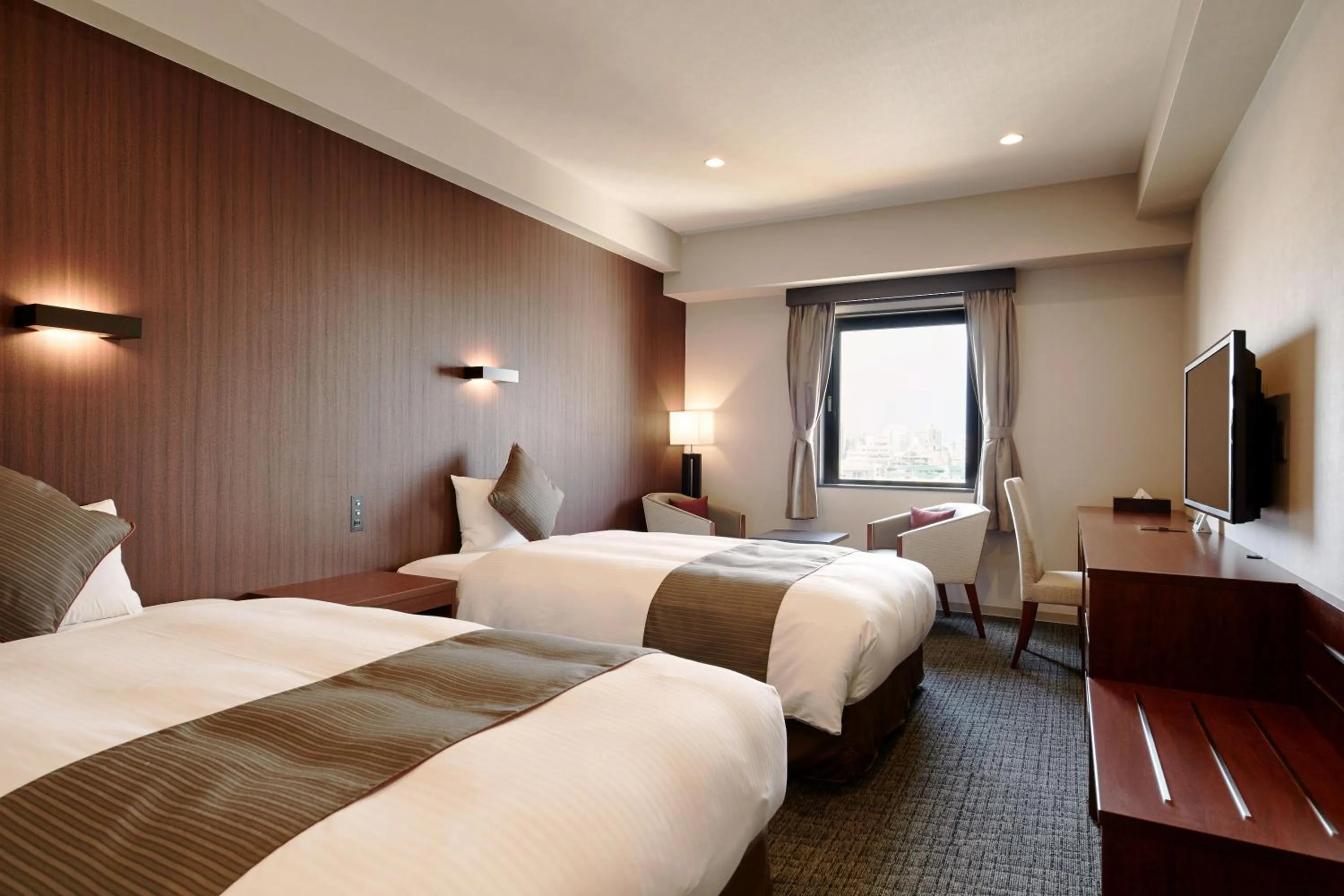 Bed in Hotel Azat Naha