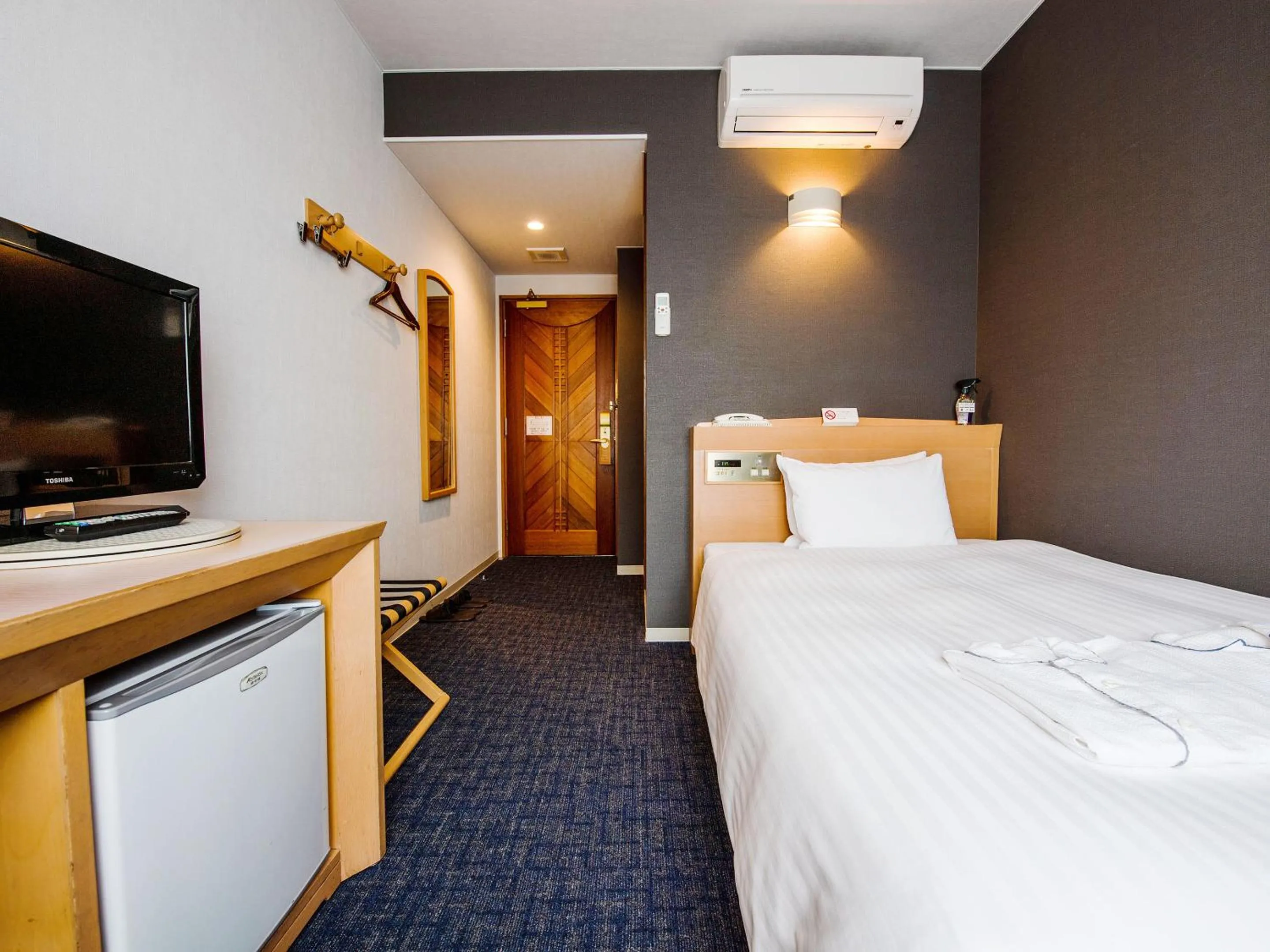 Bed in Hotel Azat Naha