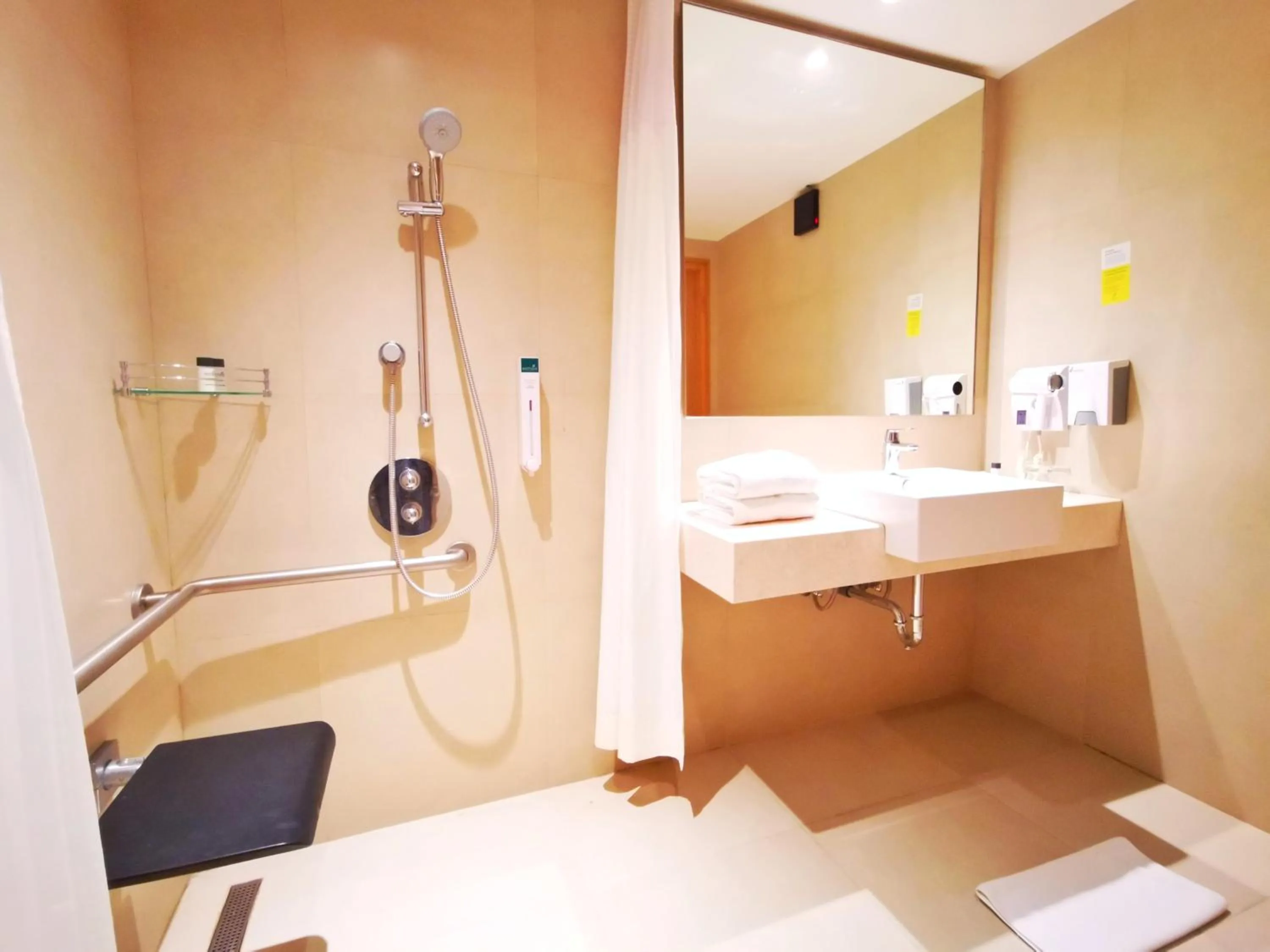 Bathroom in Holiday Inn Bengaluru Racecourse by IHG