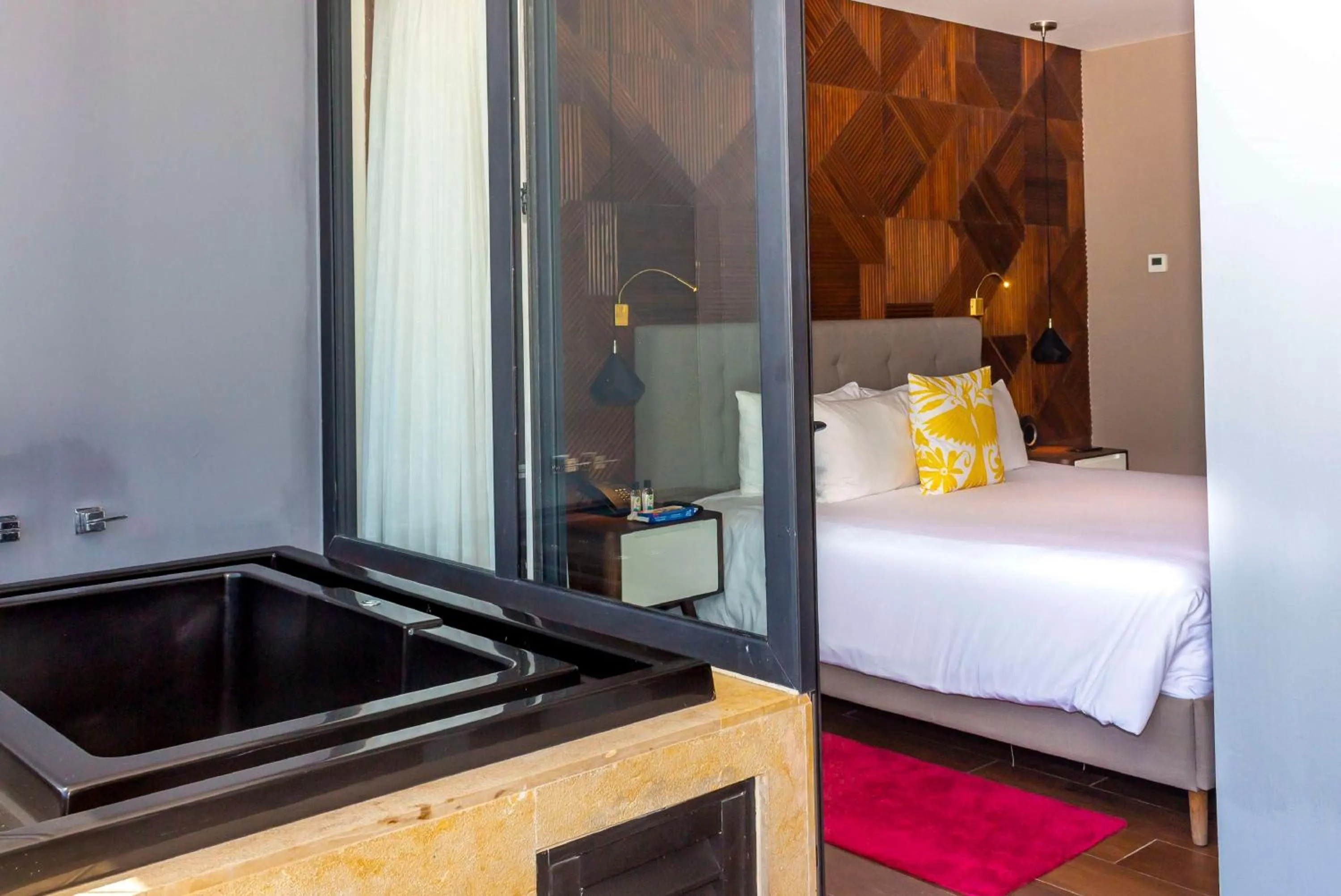 Bed in The Fives Downtown Hotel & Residences, Curio Collection by Hilton