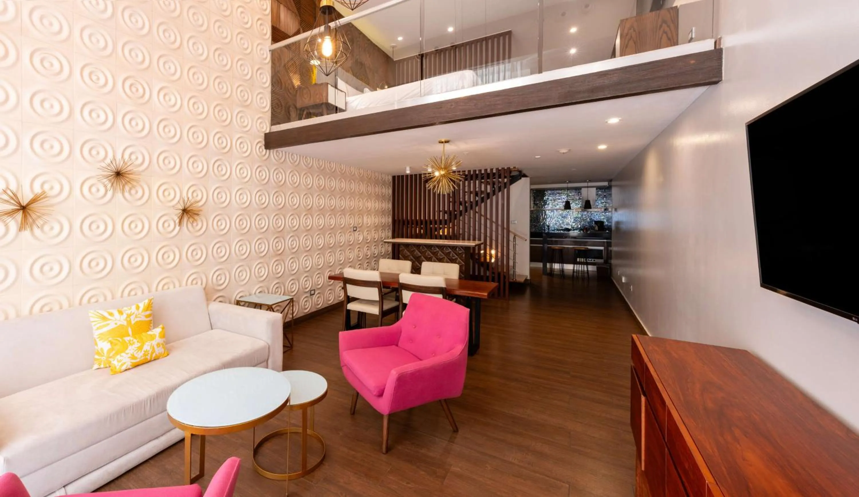 Living room in The Fives Downtown Hotel & Residences, Curio Collection by Hilton