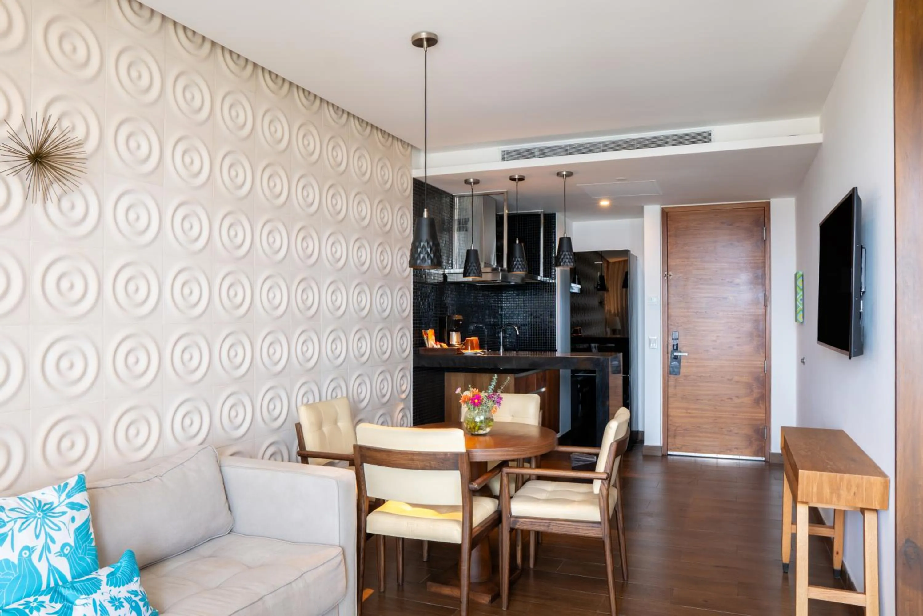 Living room in The Fives Downtown Hotel & Residences, Curio Collection by Hilton