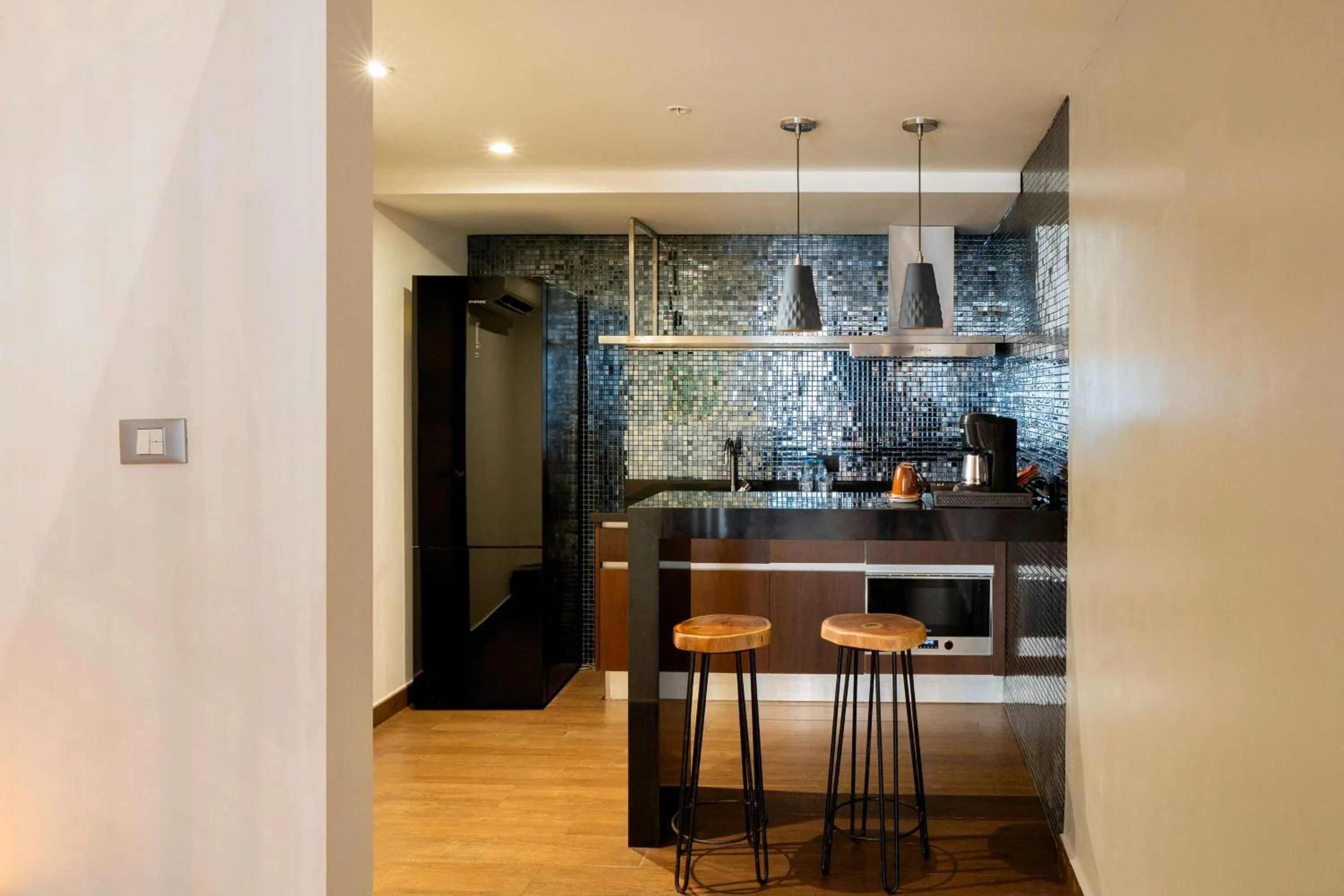 Kitchen or kitchenette in The Fives Downtown Hotel & Residences, Curio Collection by Hilton