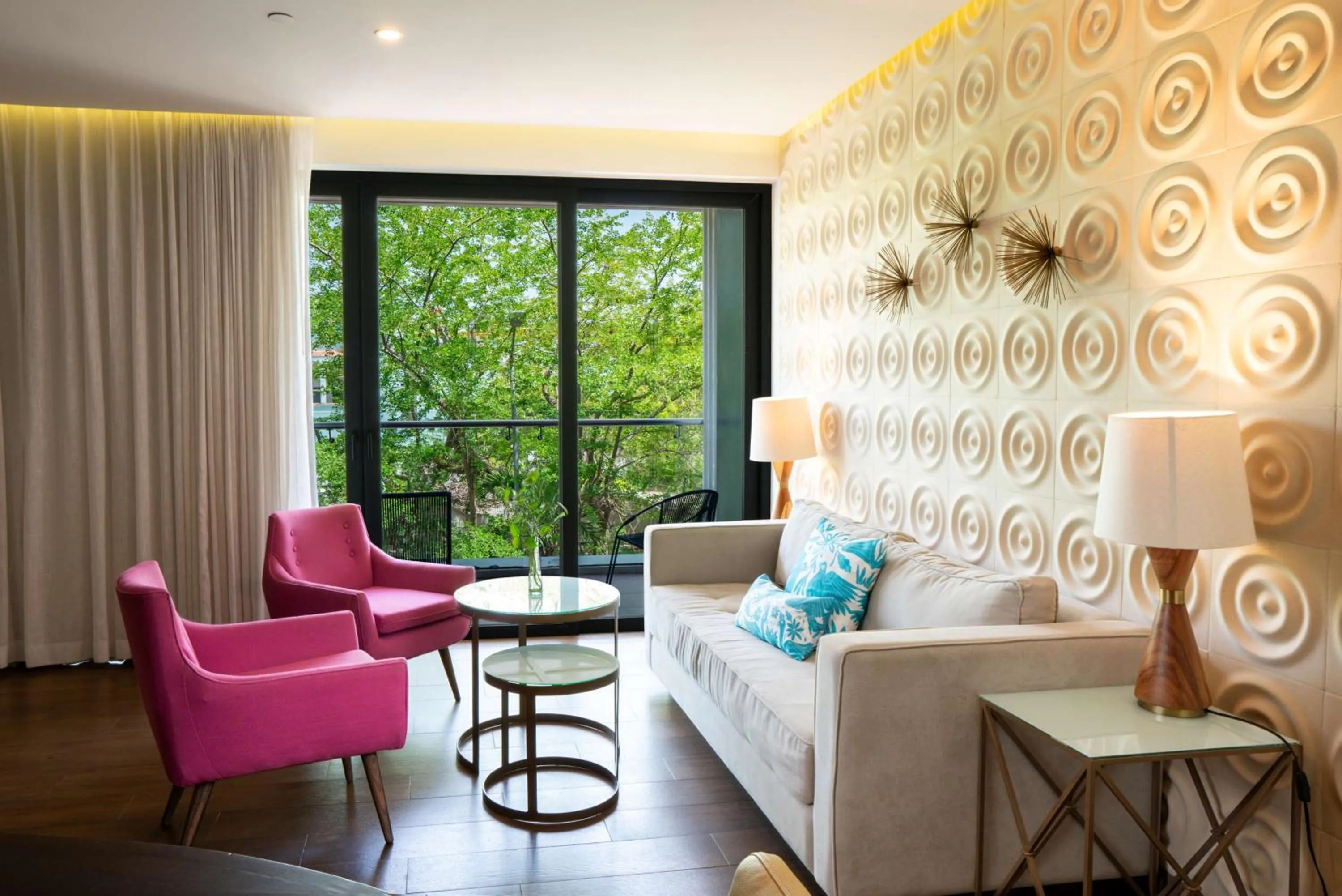 Living room in The Fives Downtown Hotel & Residences, Curio Collection by Hilton