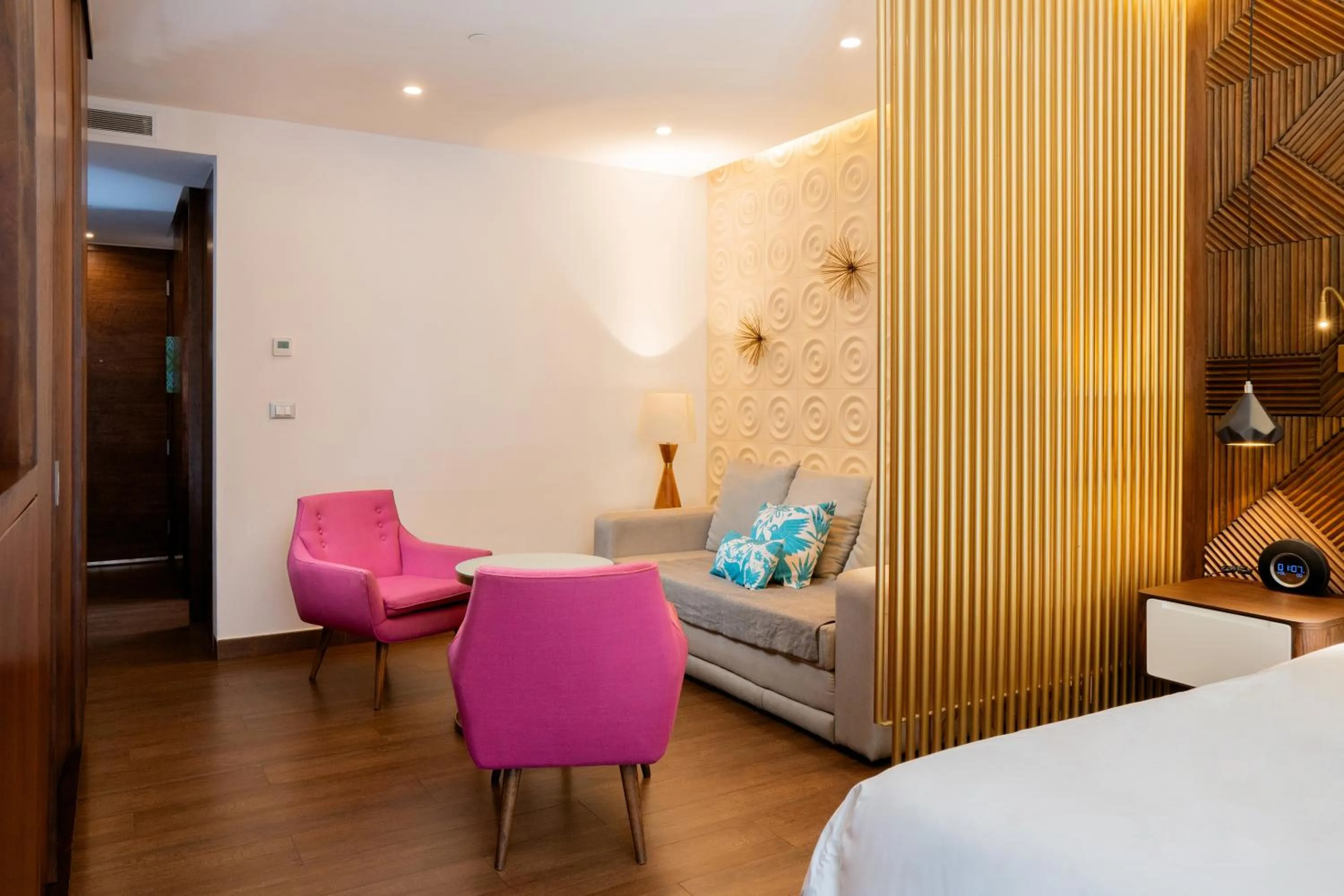 Living room, Bed in The Fives Downtown Hotel & Residences, Curio Collection by Hilton