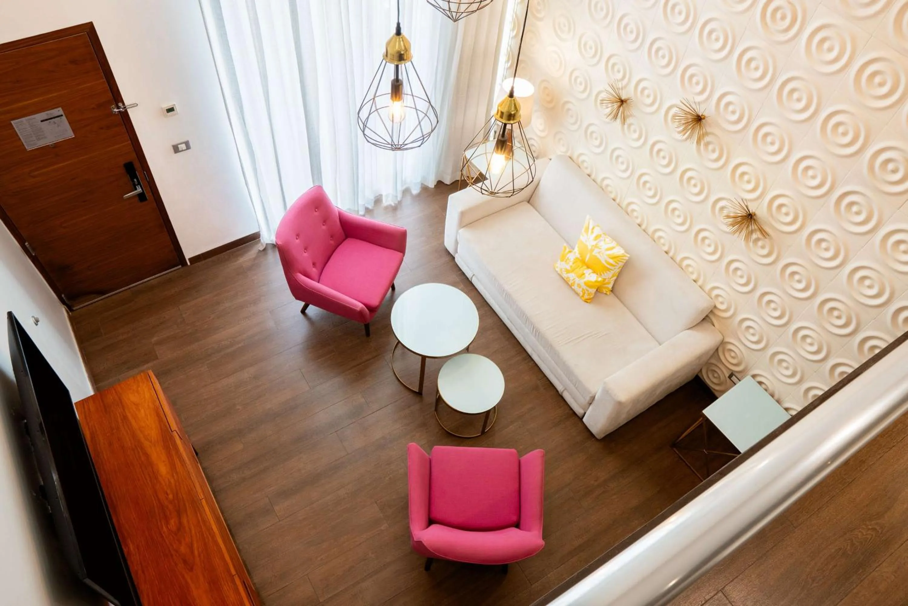 Living room, Bed in The Fives Downtown Hotel & Residences, Curio Collection by Hilton