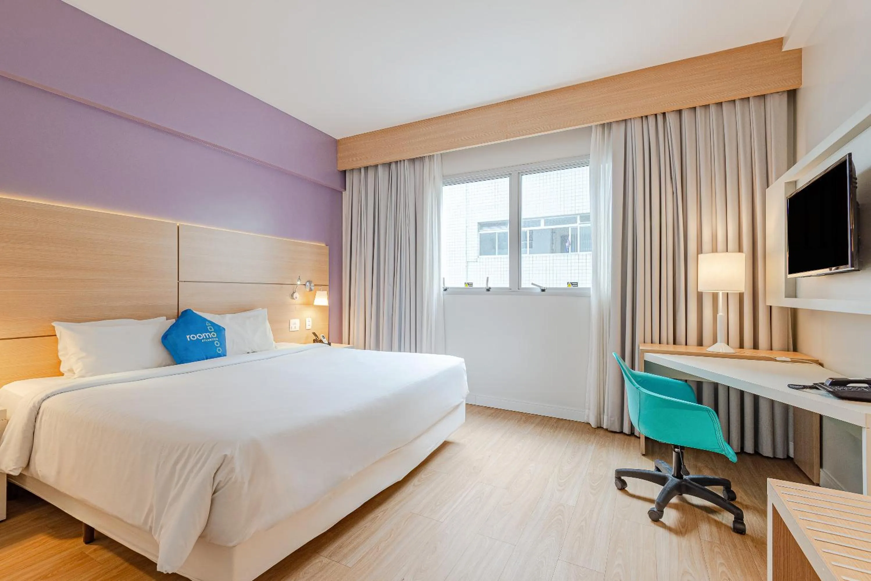 Bed in Roomo Transamerica Santos Gonzaga