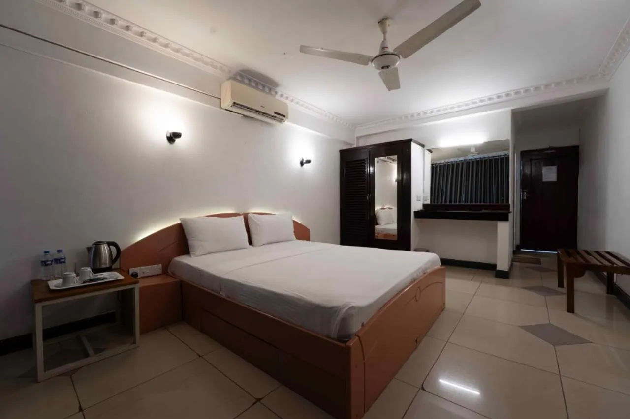 Bed in Topaz Beach Hotel