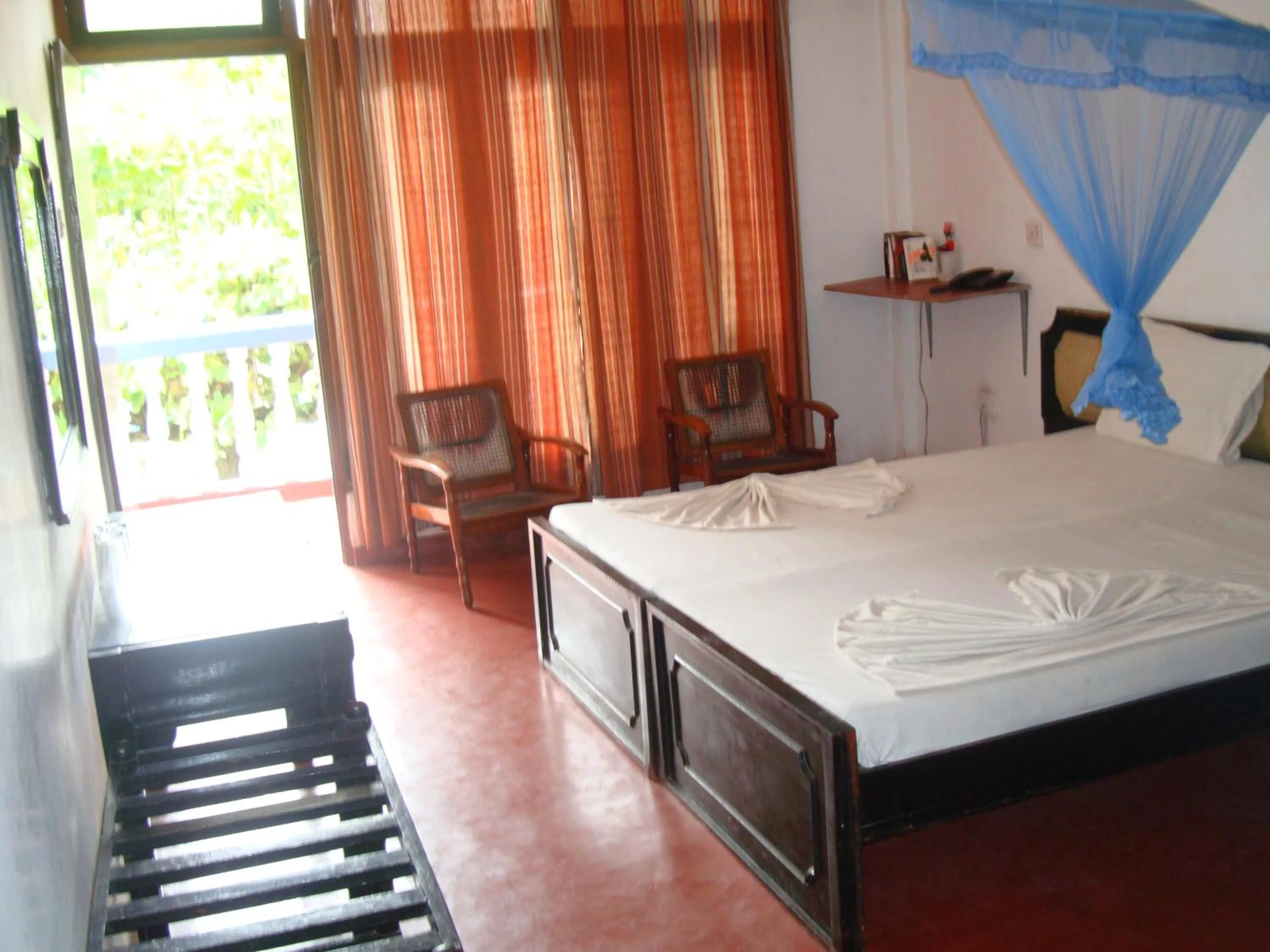 Bed in Topaz Beach Hotel