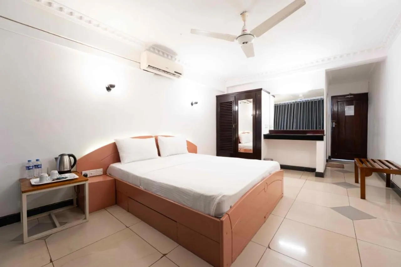 Bed in Topaz Beach Hotel