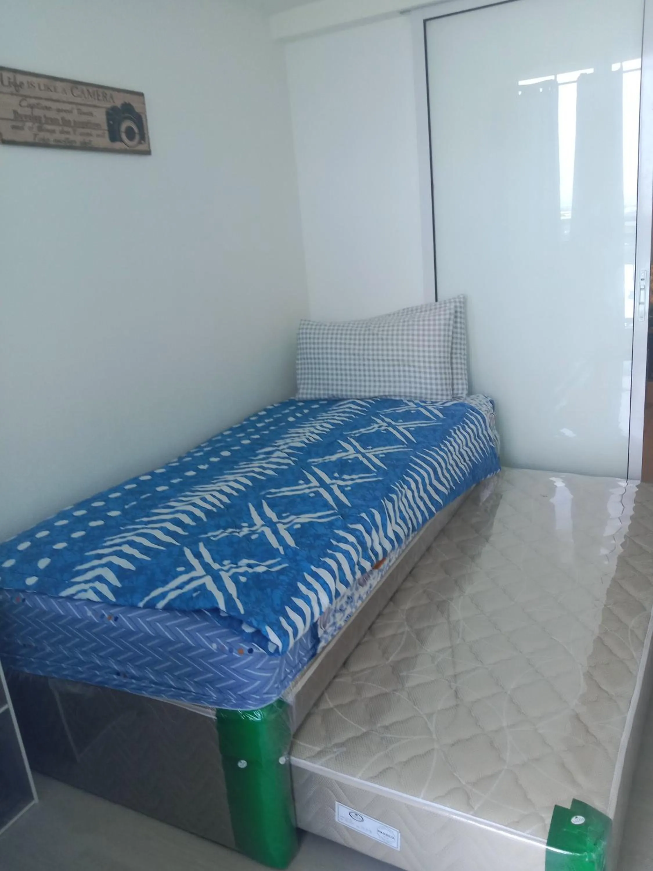 Bed in Azure Residences by Van Florendo