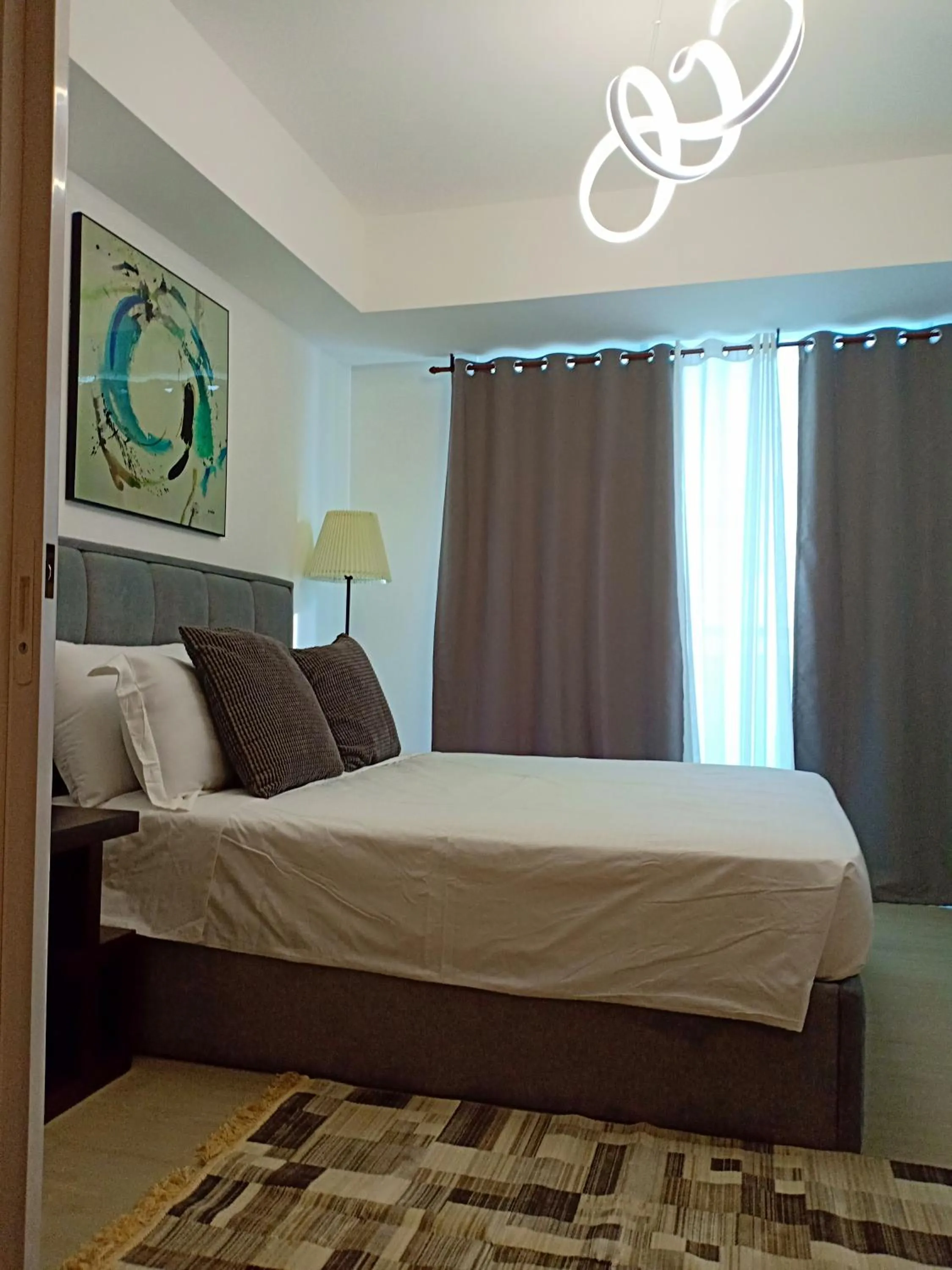 Bed in Azure Residences by Van Florendo