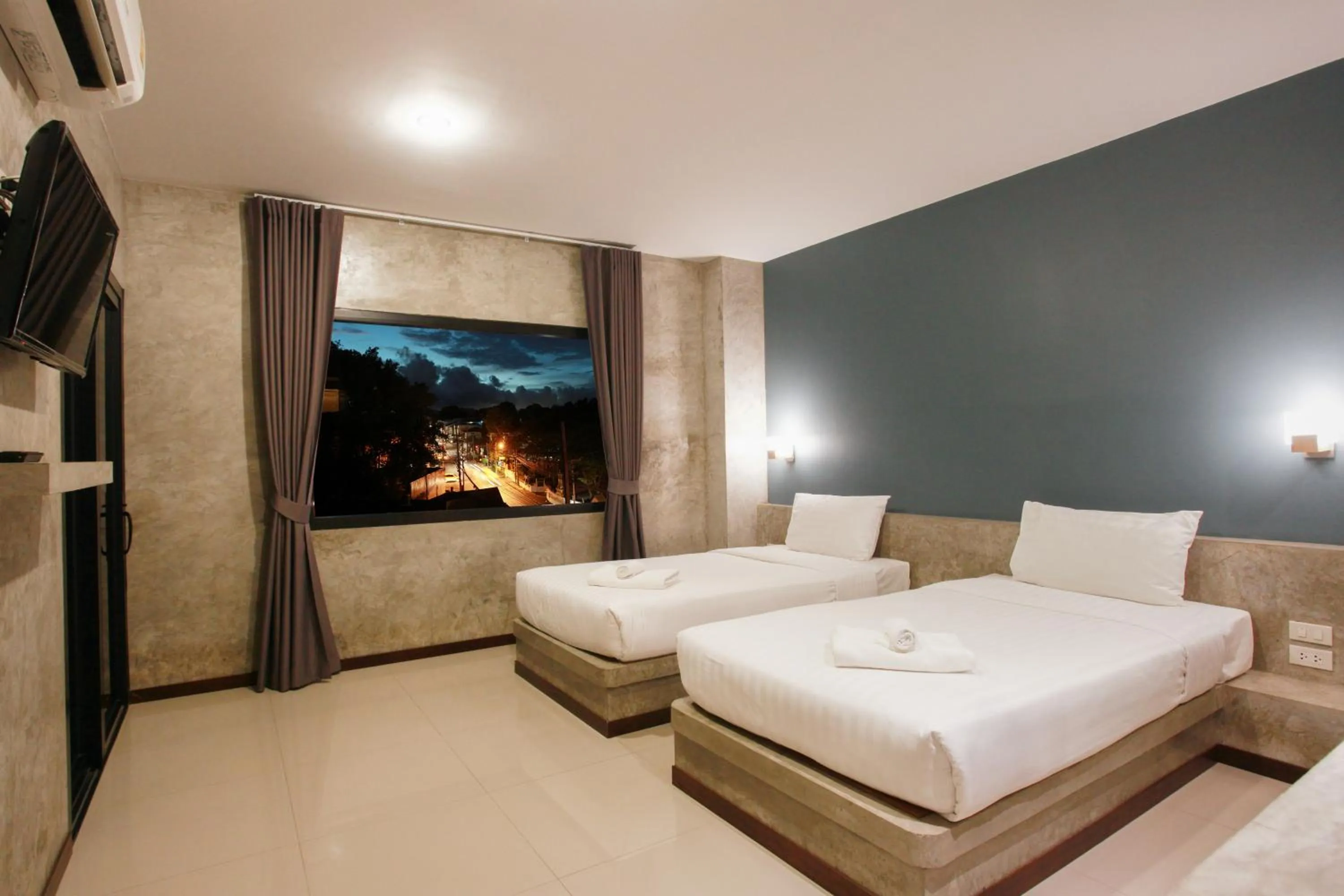 Bed in Ritsurin Boutique Hotel - โรงแรมริทสุริน บูติค