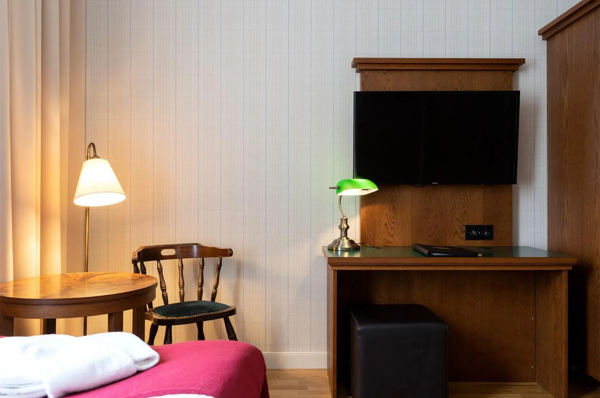 Seating area, Bed in Hotel Bishops Arms Kristianstad