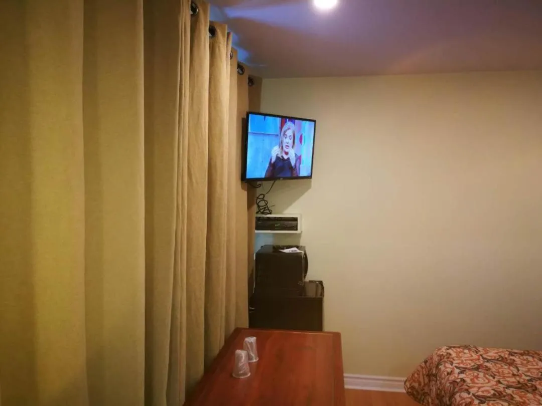 Bed in Motel Chez Nous