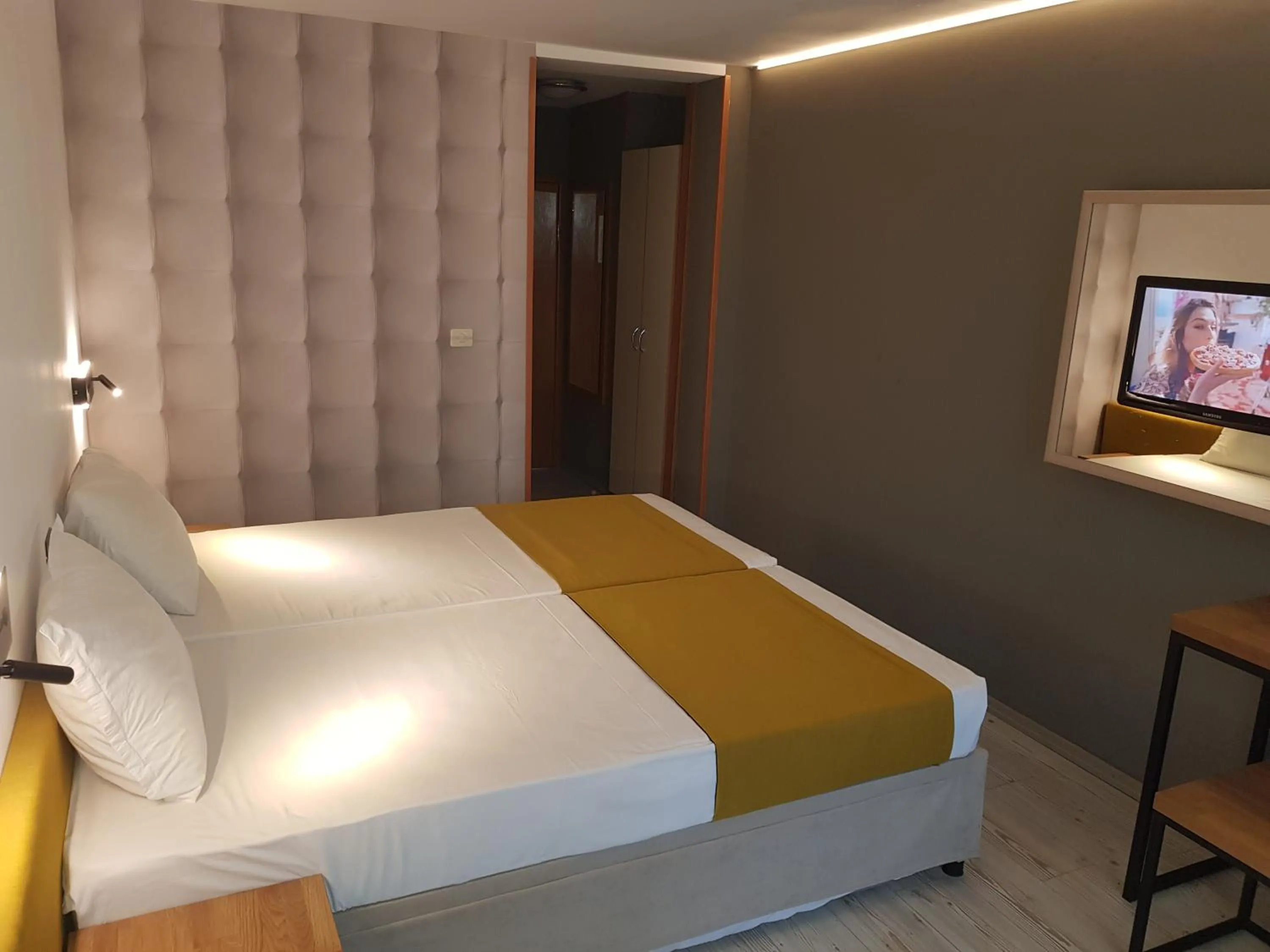 Bed in Tintyava Park Hotel