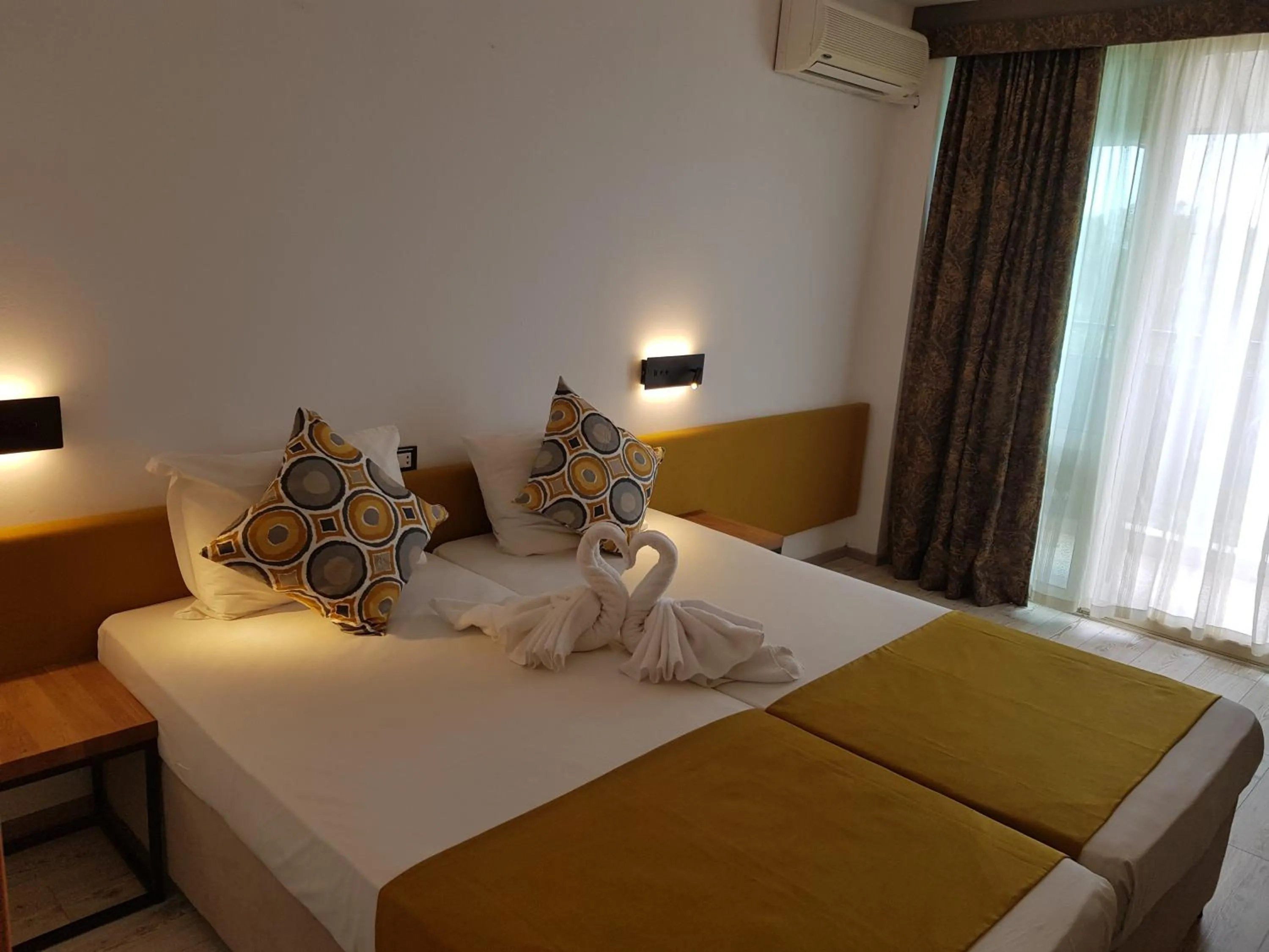 Bed in Tintyava Park Hotel