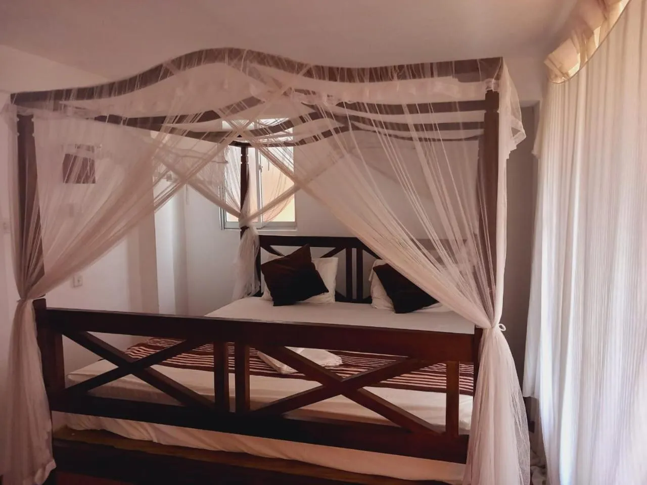 Bed in Blue Horizon Beach Hotel