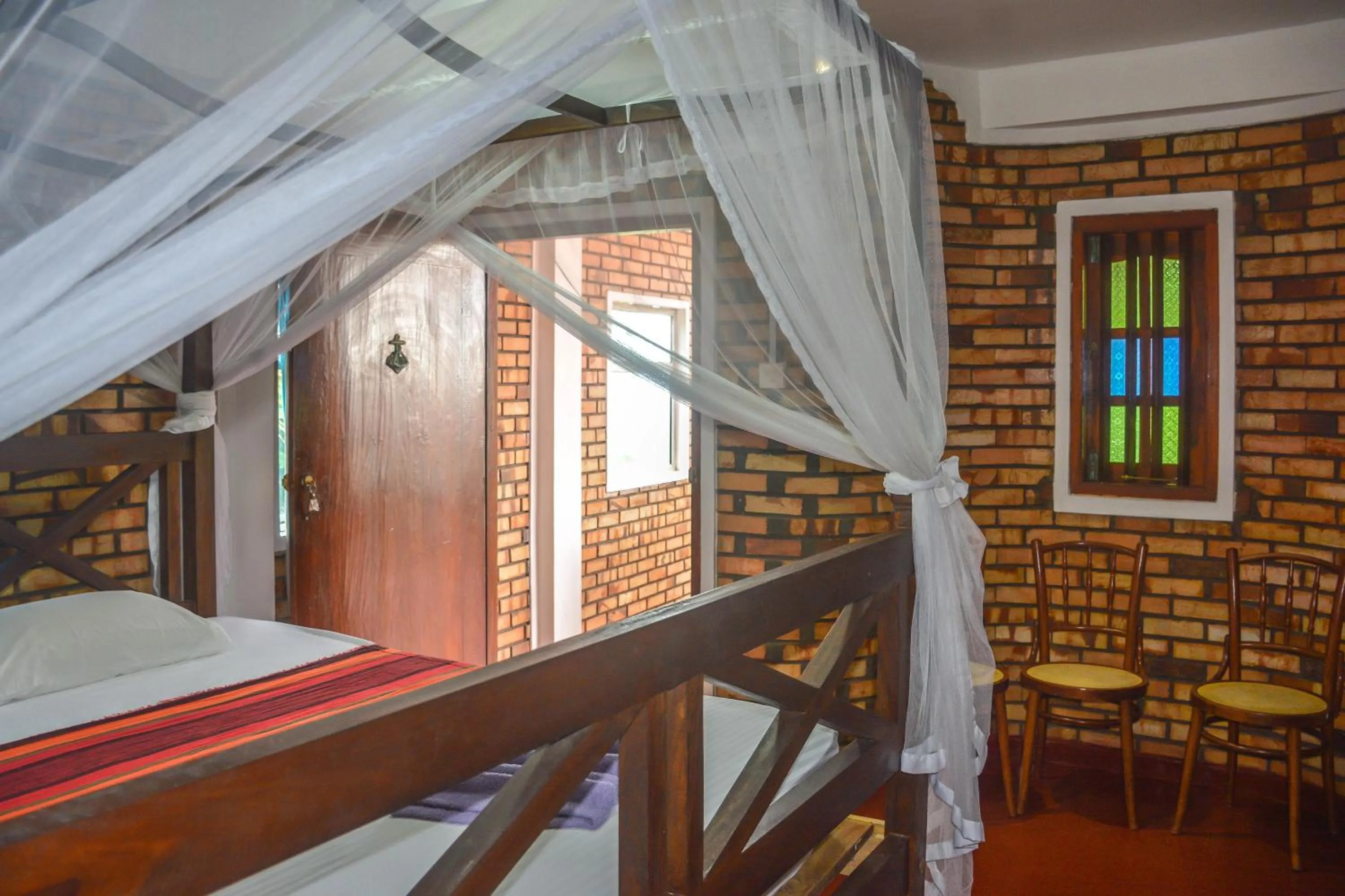 Bed in Blue Horizon Beach Hotel