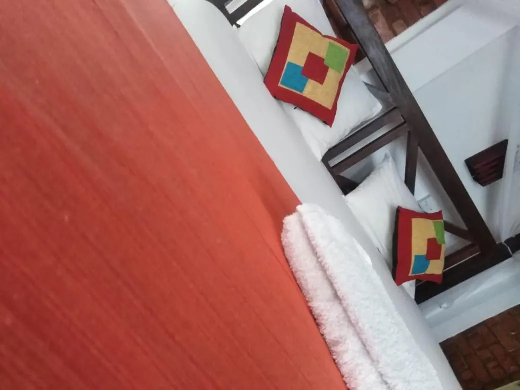 Bed in Blue Horizon Beach Hotel