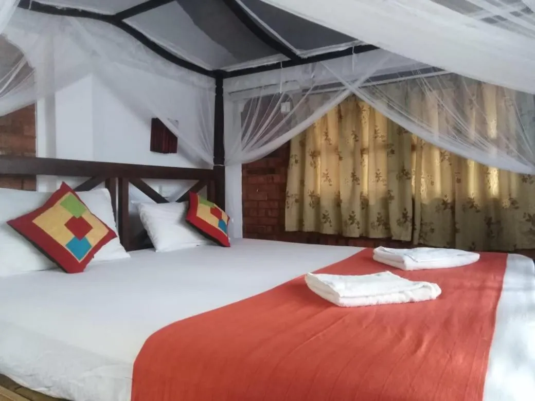 Bed in Blue Horizon Beach Hotel