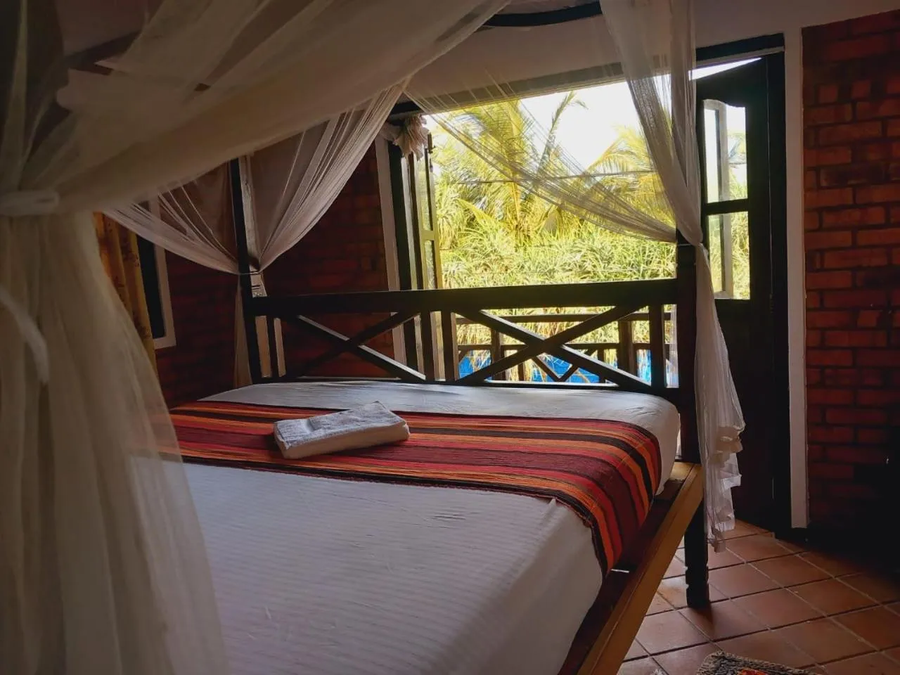 Bed in Blue Horizon Beach Hotel