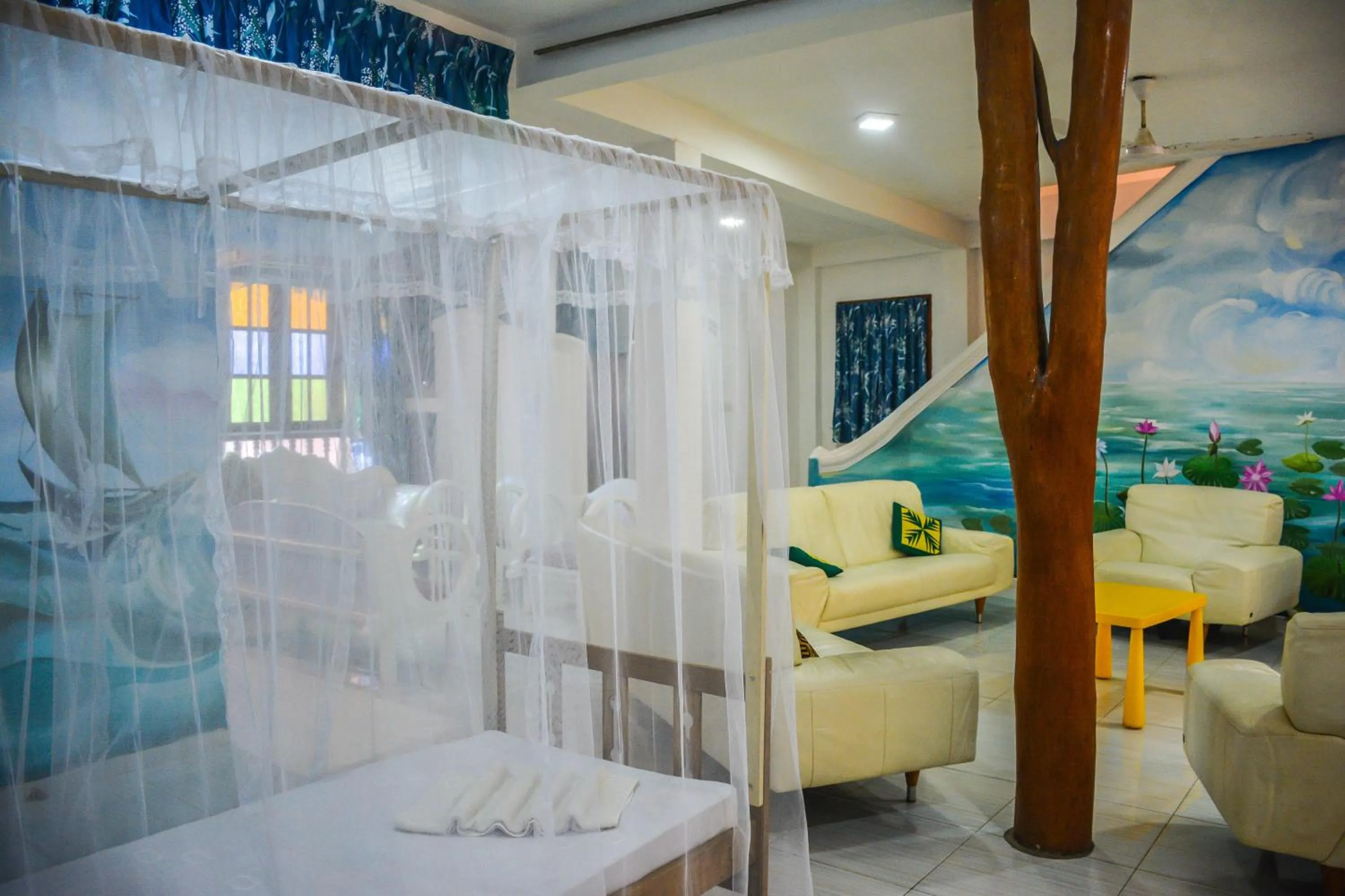 Bed in Blue Horizon Beach Hotel