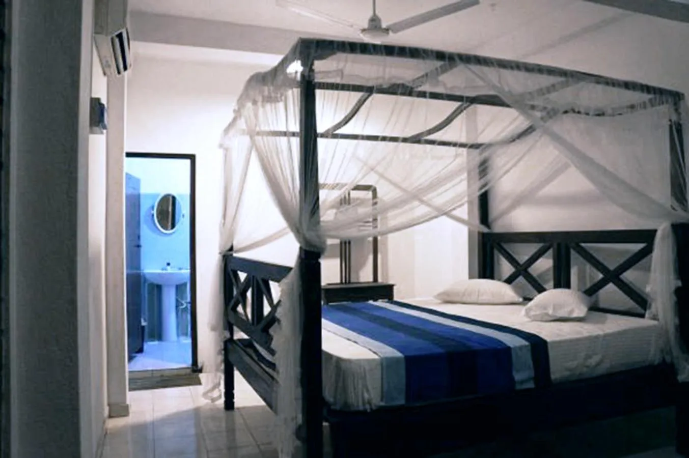 Bed in Blue Horizon Beach Hotel