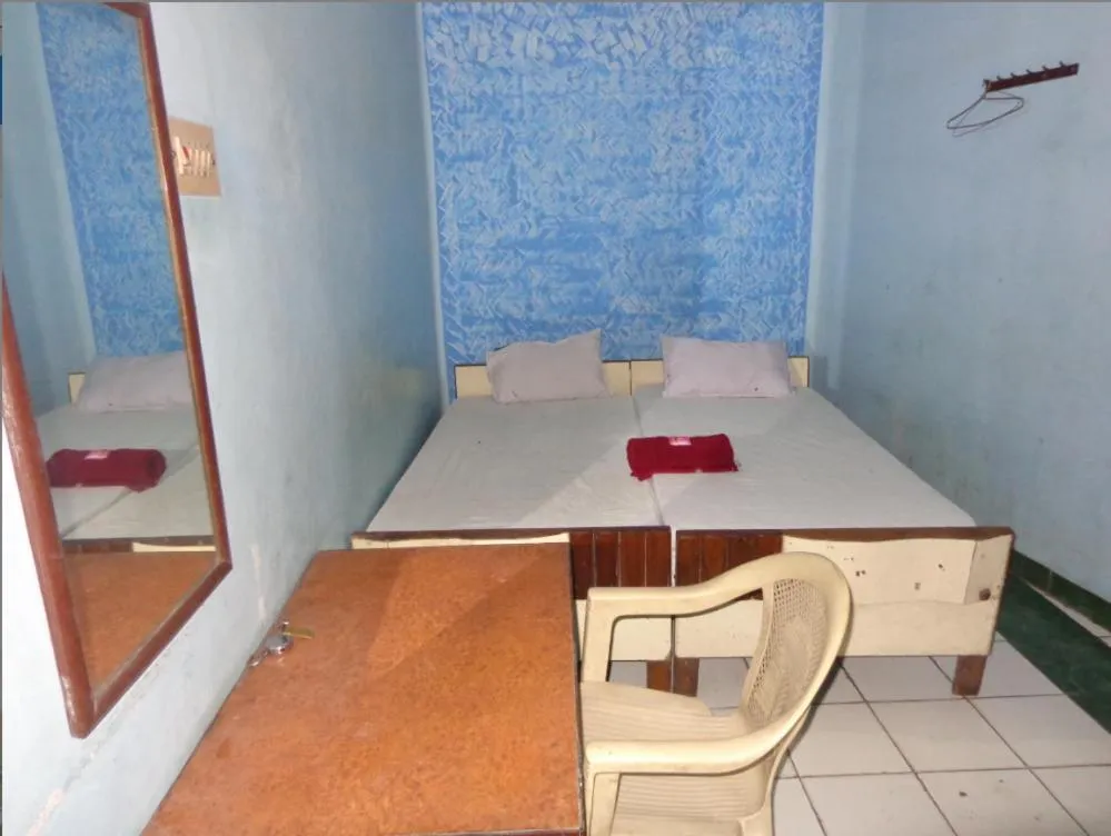 Photo of the whole room, Bed in Luxmi Hotel