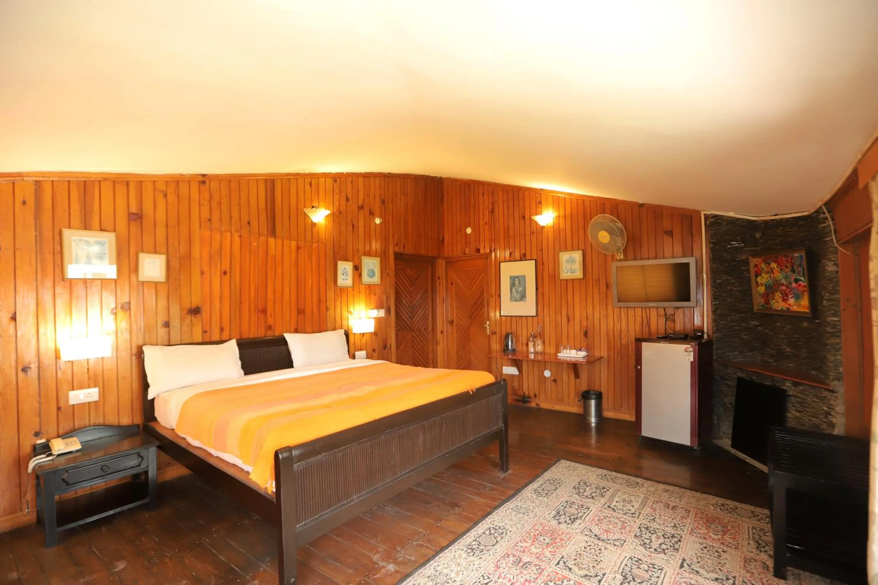 Seating area, Bed in Cedar Lodge By Aahma