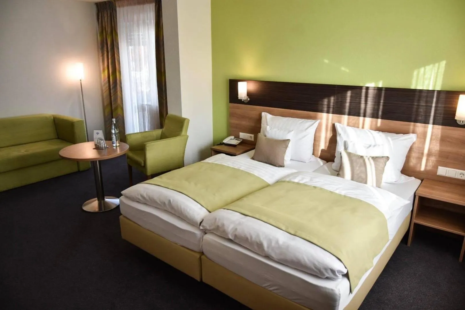 Seating area, Bed in Martins Klause Airport Messe Hotel - Self Check-In