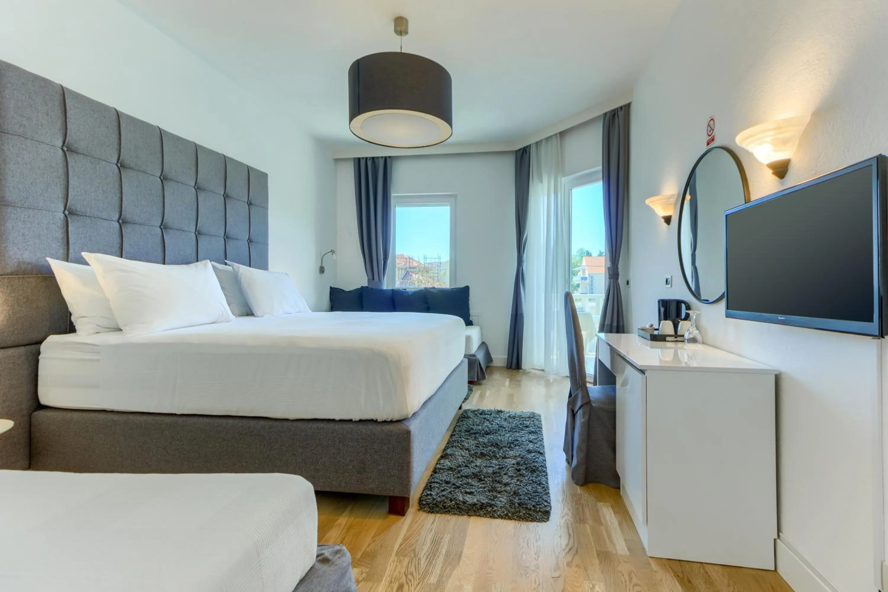 Bed in Hotel Riva Kaštela with swimming pool