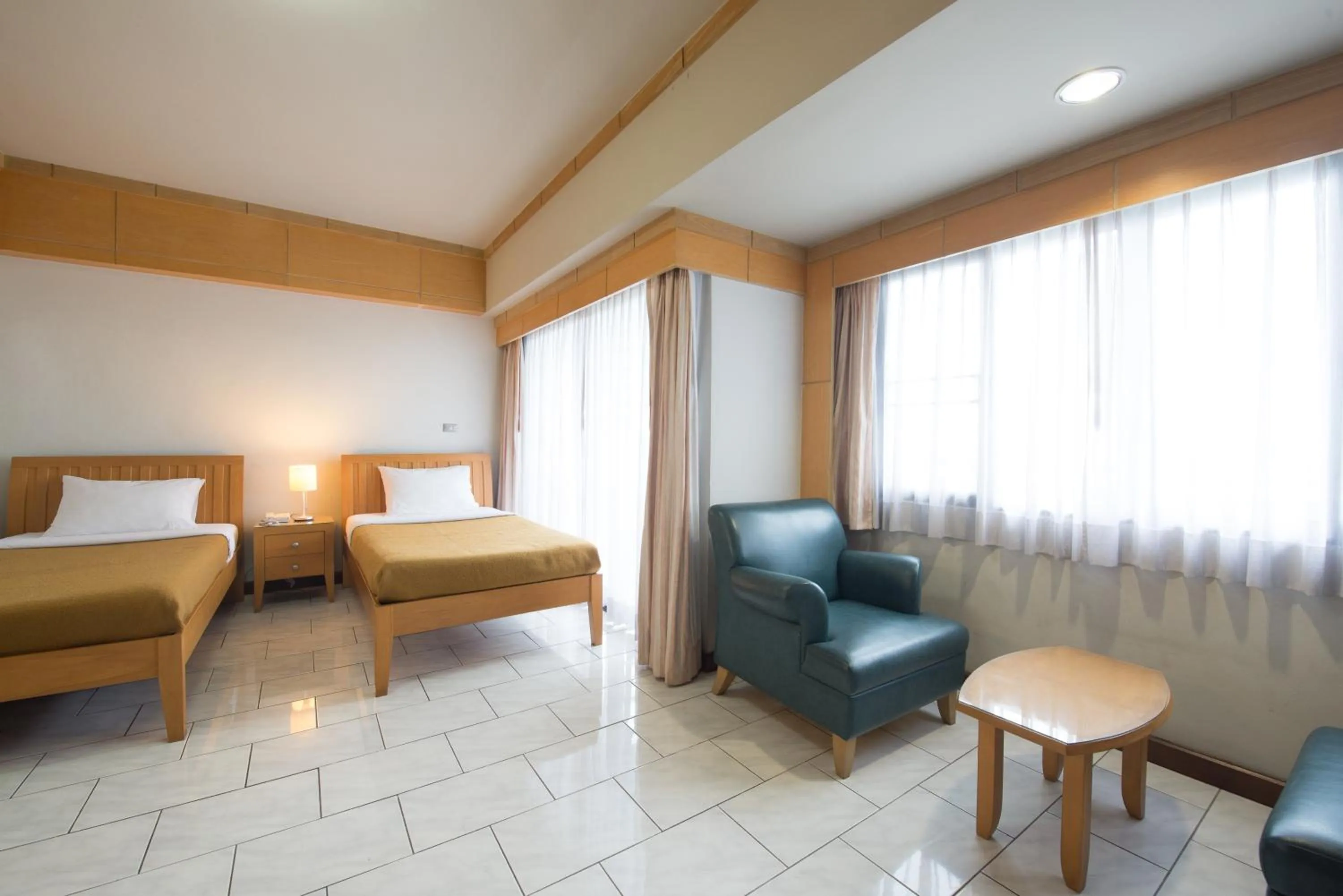 Seating area, Bed in Baan Pratoom