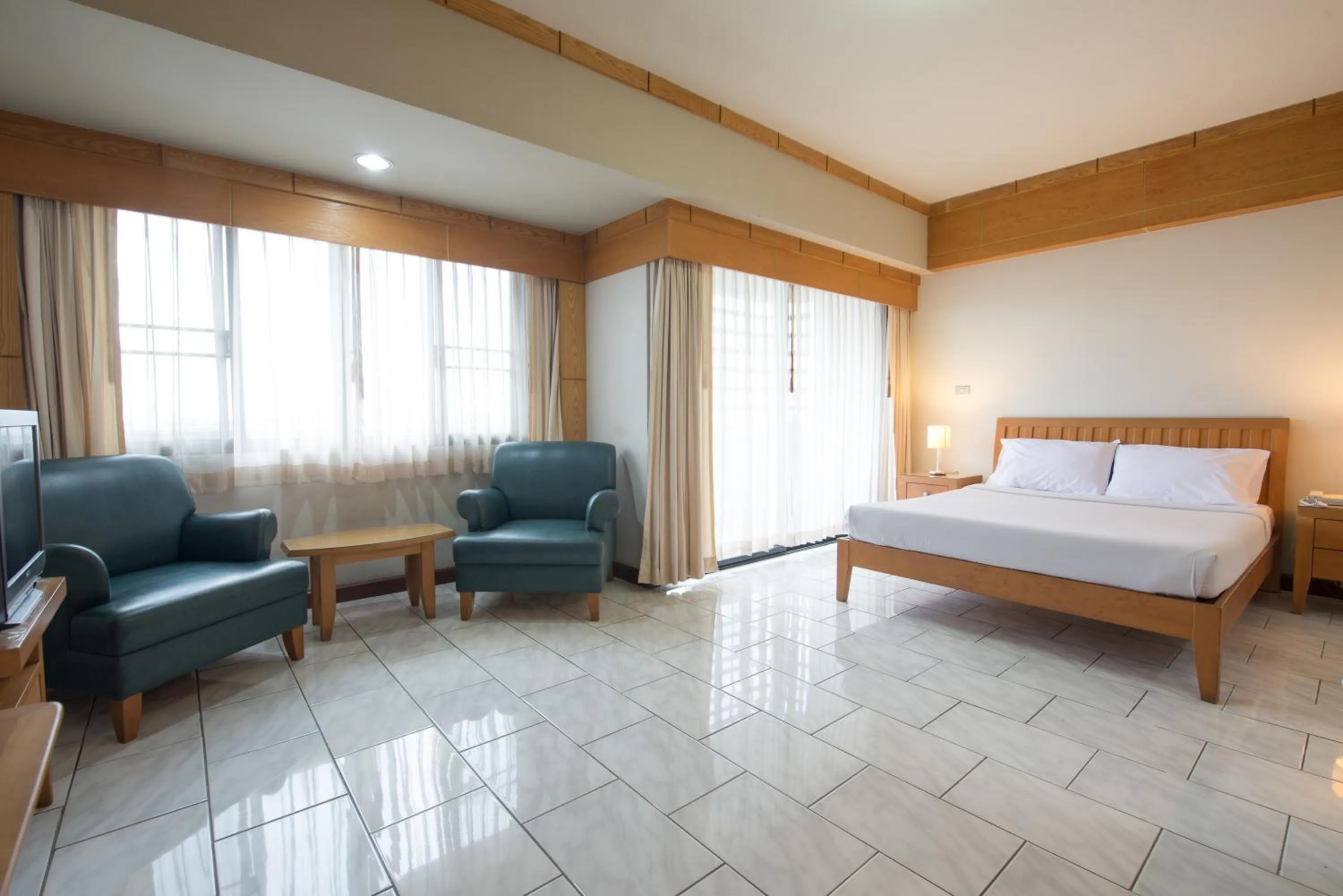 Seating area, Bed in Baan Pratoom