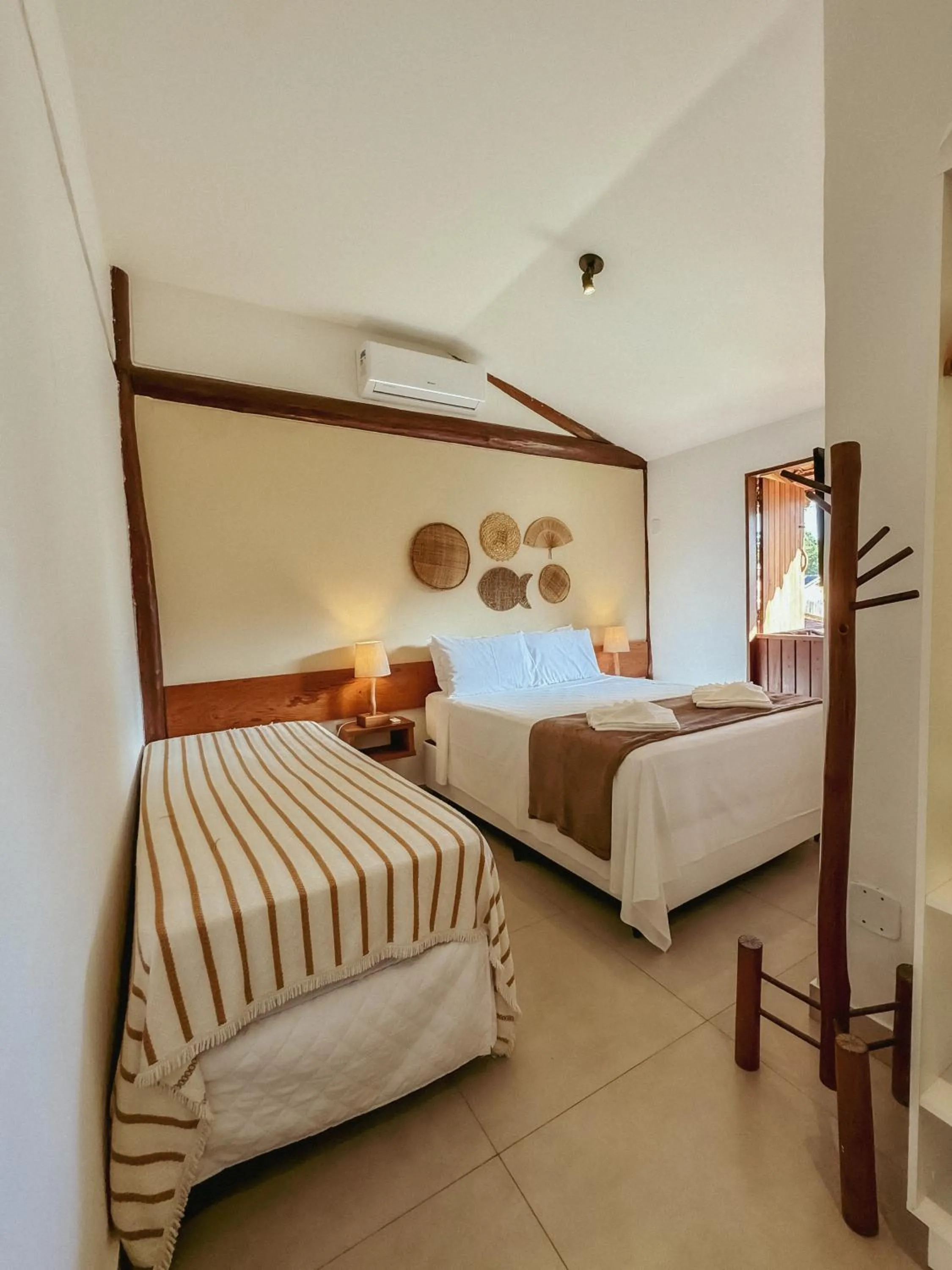 Bed in Tororao Hotel Pousada