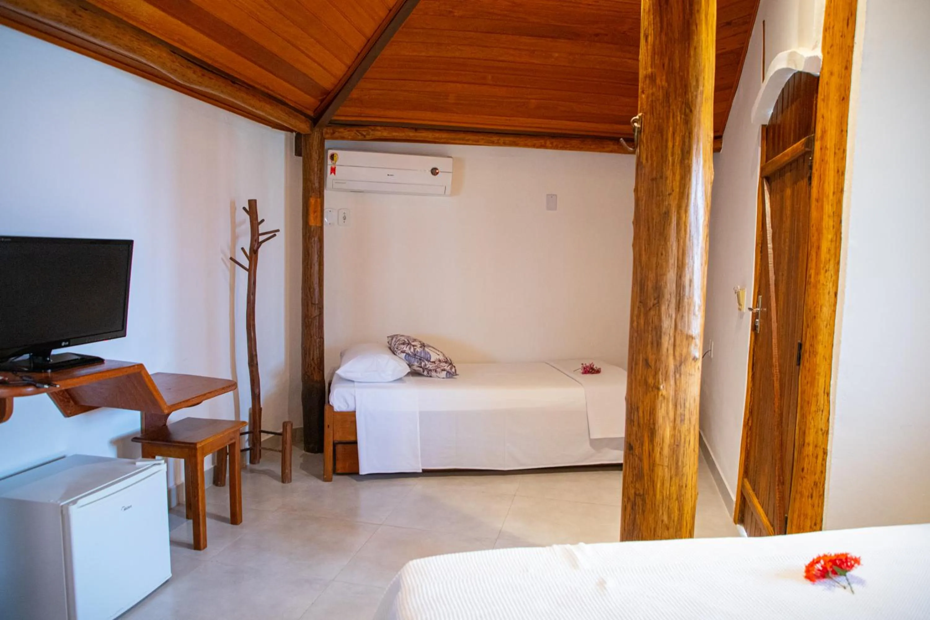 Bed in Tororao Hotel Pousada