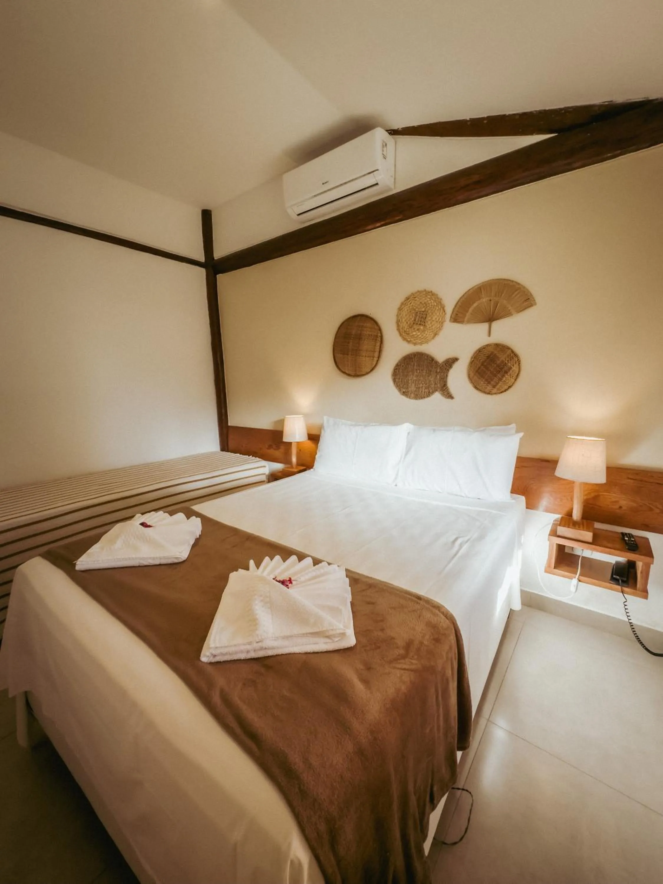 Bed in Tororao Hotel Pousada