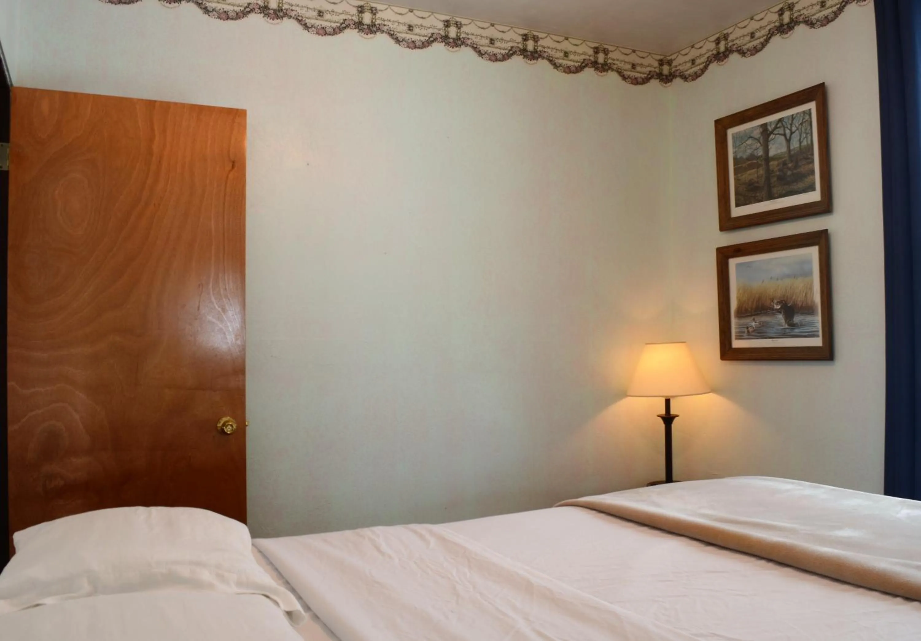 Bed in Little River Inn Motel